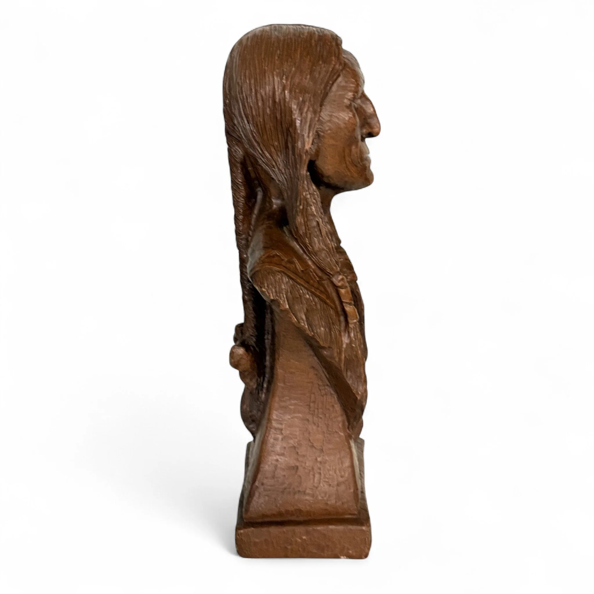 Vintage 1980s Red Mill Mfg Native American Indian chief statue made of crushed pecan shells and resin in reddish brown, detailed tabletop decor.