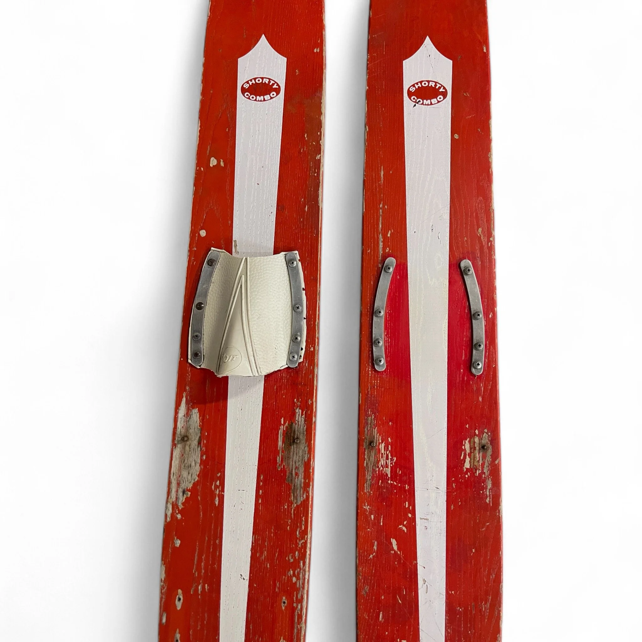 Vintage pair of red white Sears Shorty Combo wooden water skis, well weathered and perfect for beach house decor.