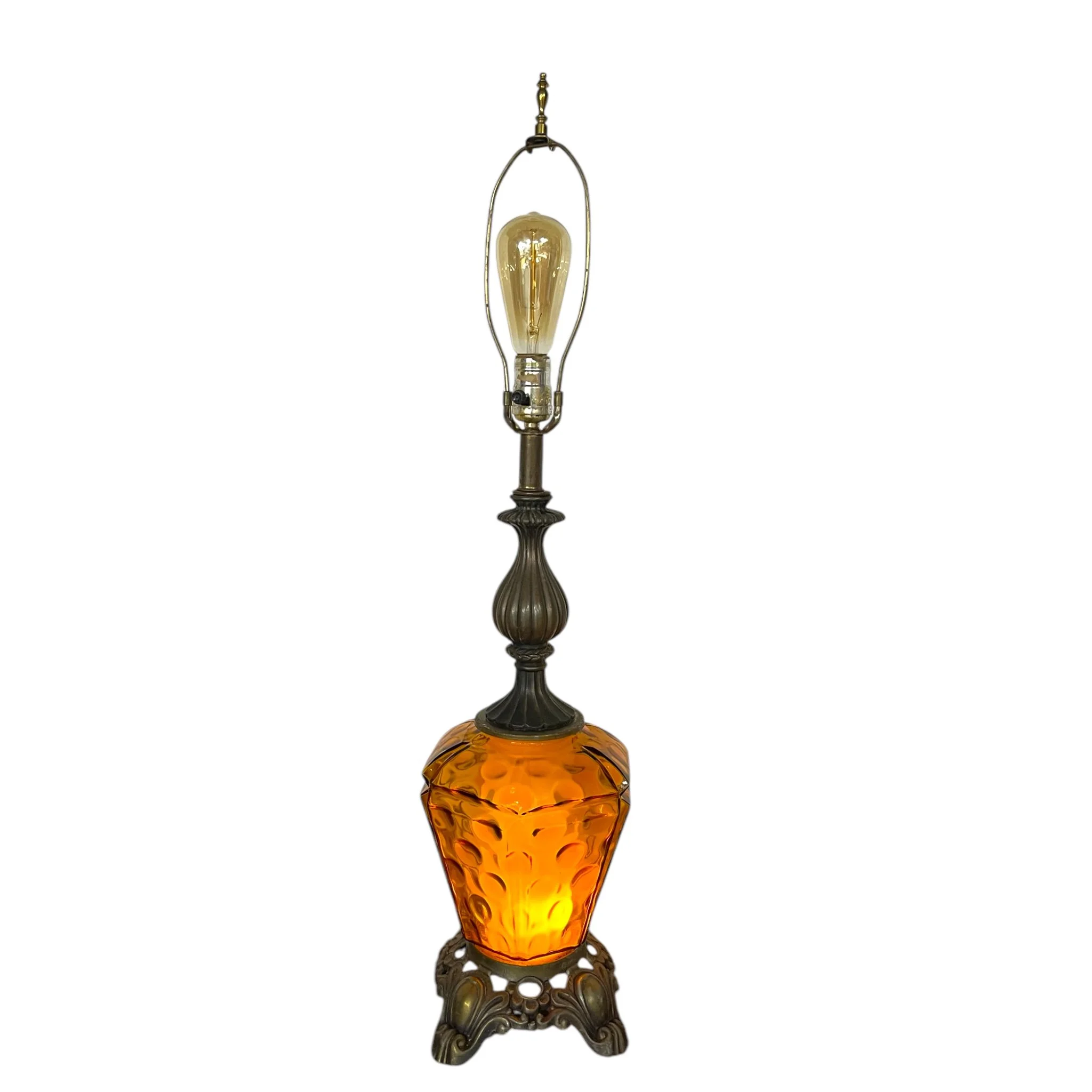Vintage amber glass and ornate metal table lamp, no shade. Featuring double light option. Perfect for Hollywood Regency, Spanish Revival, or mid century modern interiors.
