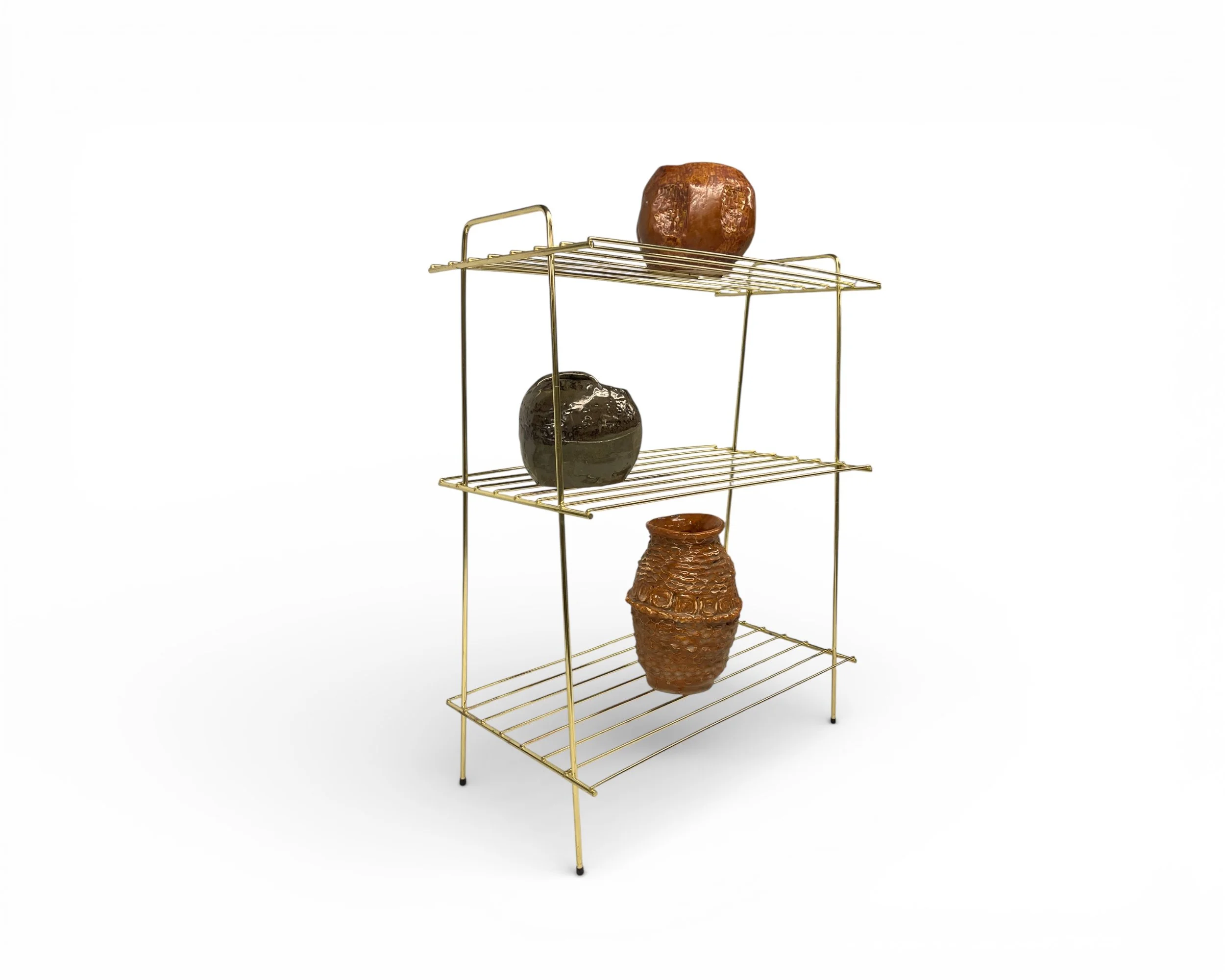 mid century gold metal plant stand display shelf styling example