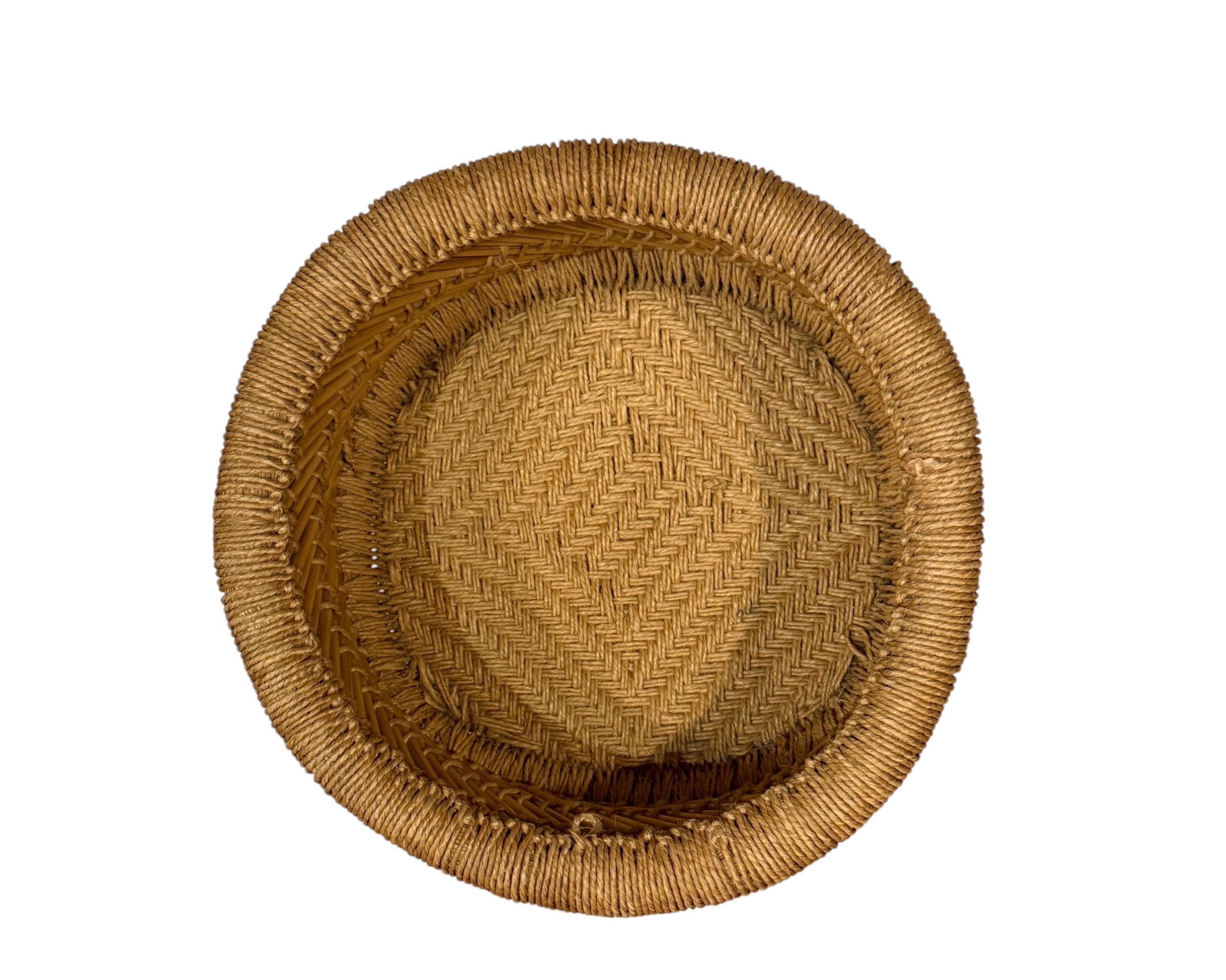 Vintage woven rattan basket with rolled rim and decorative band inside front view