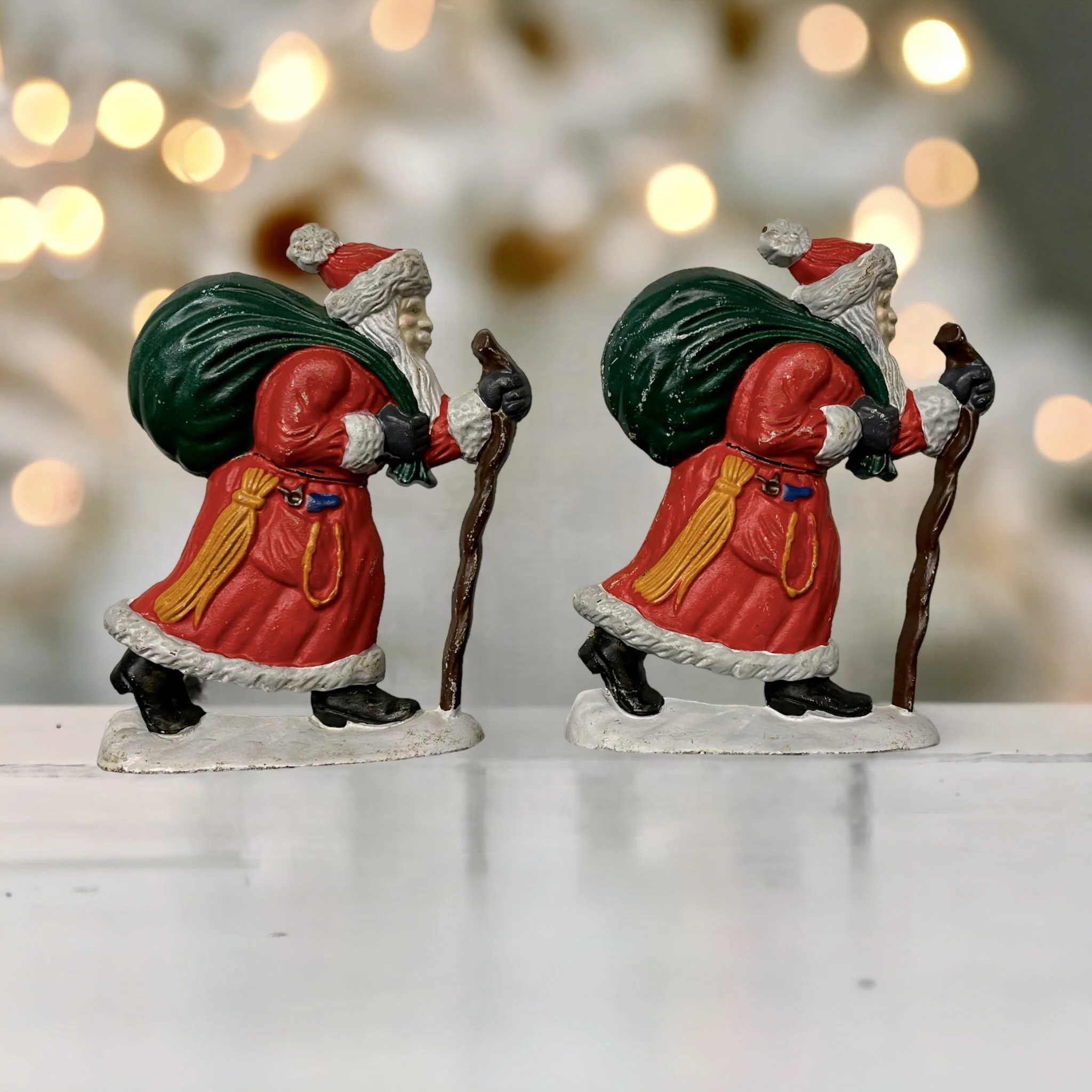 pair vintage Santa cast iron door stops