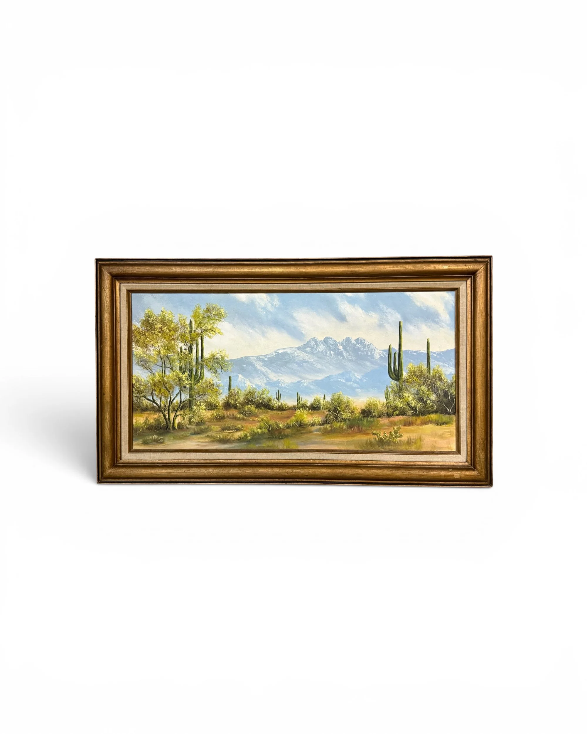 Southwestern desert landscape artwork with towering saguaro cacti and Four Peaks mountains under a soft blue sky.