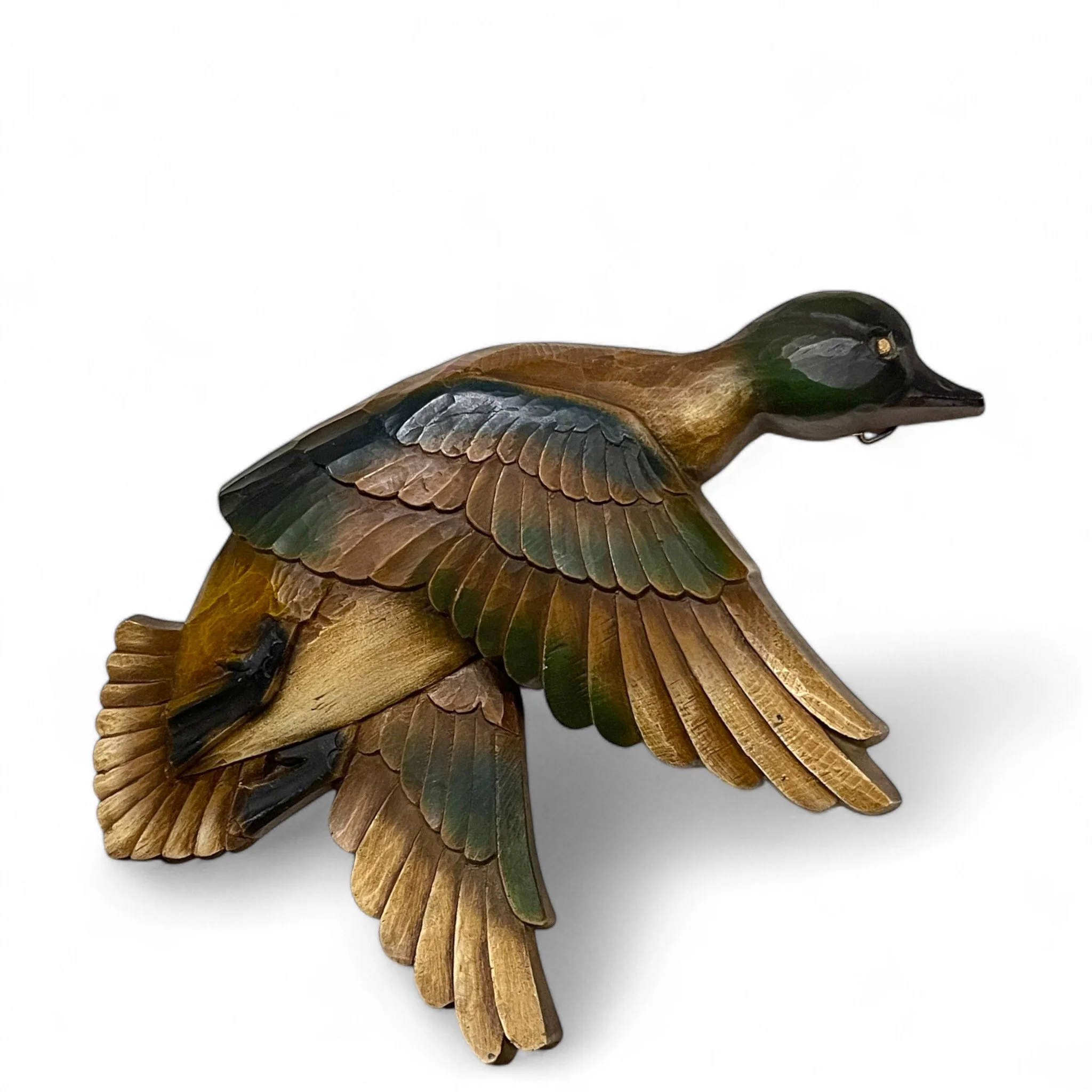 Set of 3 vintage Syroco flying mallard duck wall hangings, featuring lifelike details with carved feathers, outstretched wings, and classic brown green tones. Rustic, or nature inspired home decor.