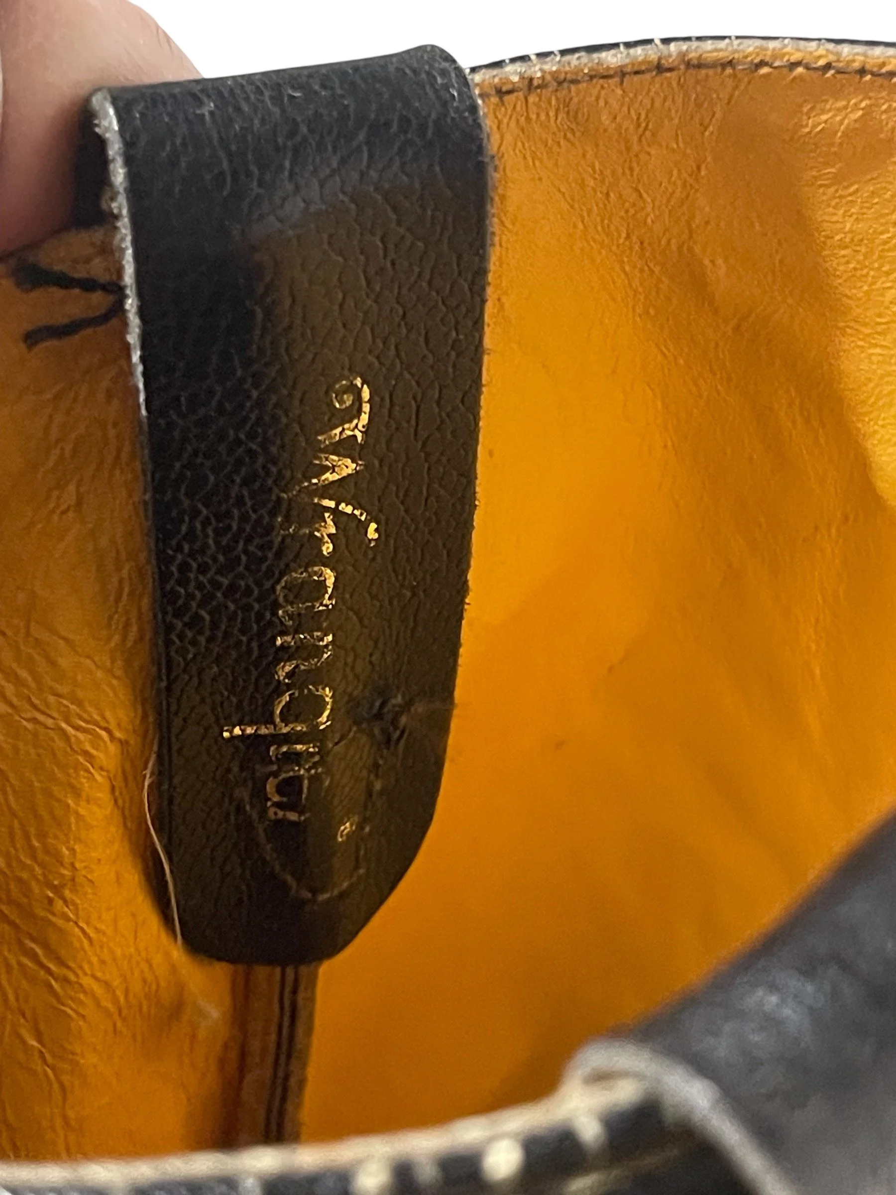 Vintage mens black leather cowboy boots by Wrangler, size 13, mid shaft, classic R toe, pull strap, minimalist stitching, western heel.