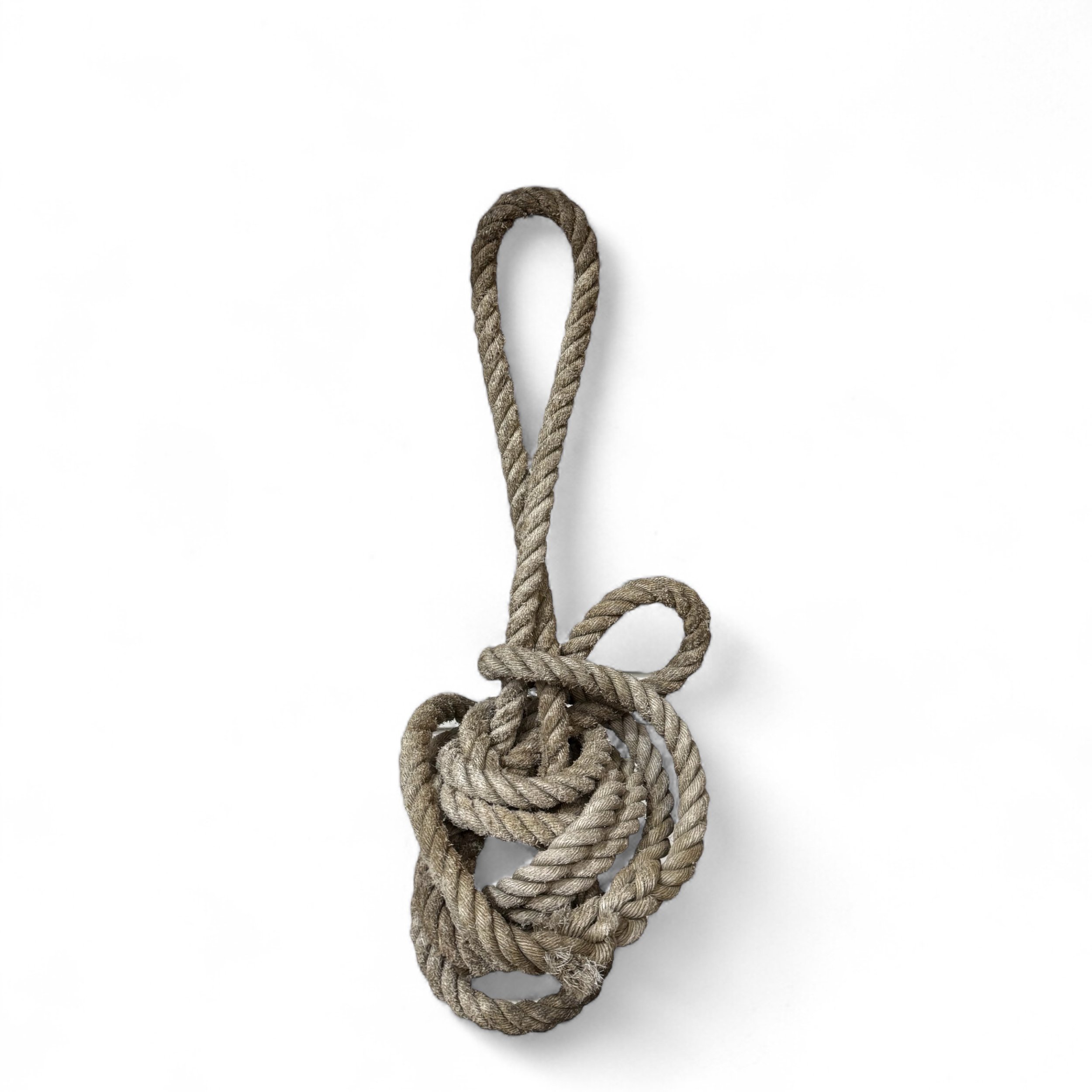Vintage nautical knotted rope on white surface for wall decor use