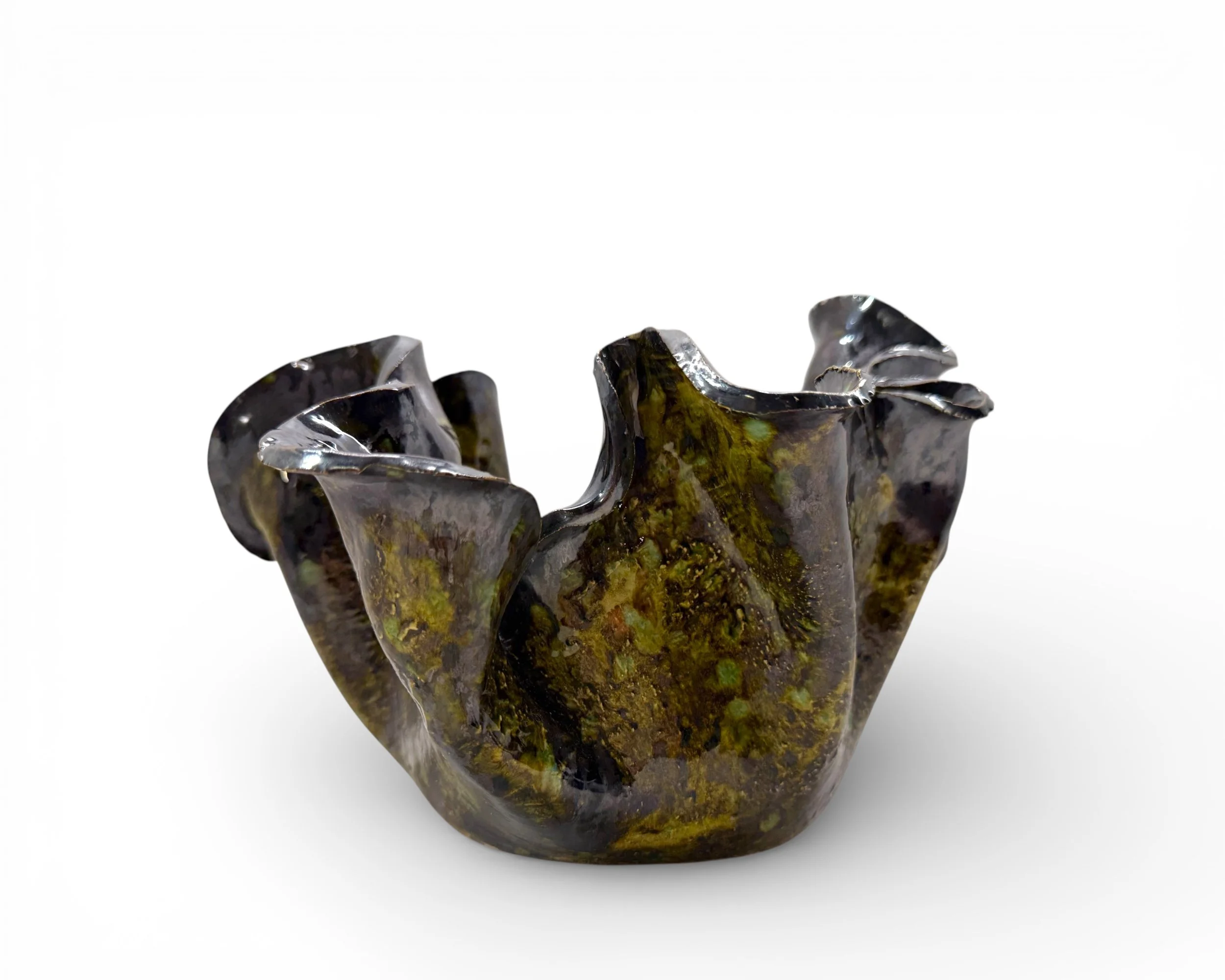 Side profile showing dramatic folded sculptural rim design