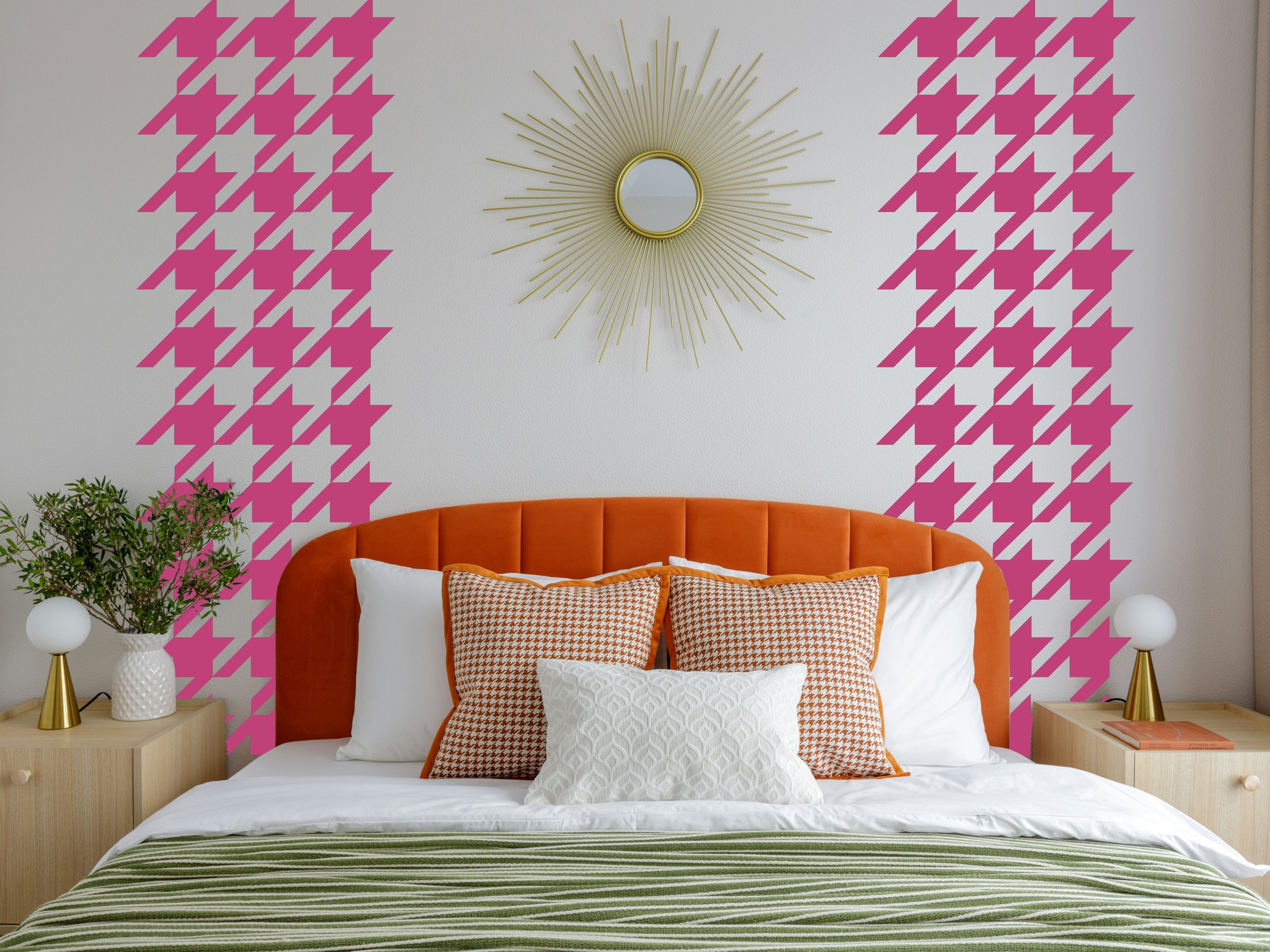 removable houndstooth pattern vinyl wall decal shown in pink above the headboard of a bed