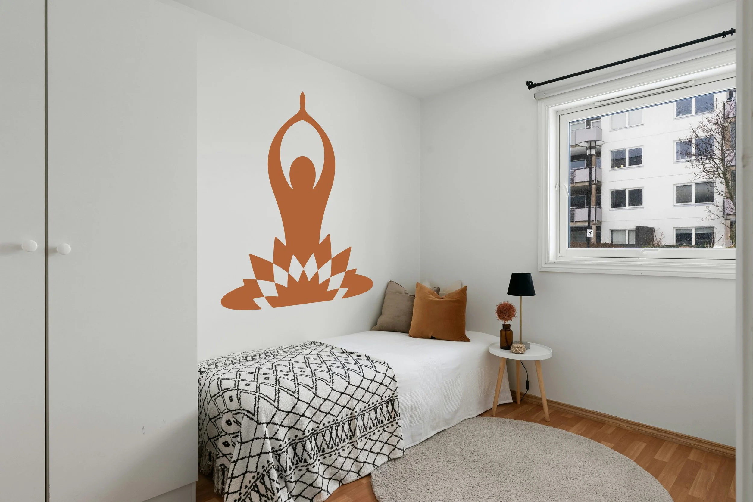 Yoga pose with lotus flower removable vinyl wall decal in nut brown.