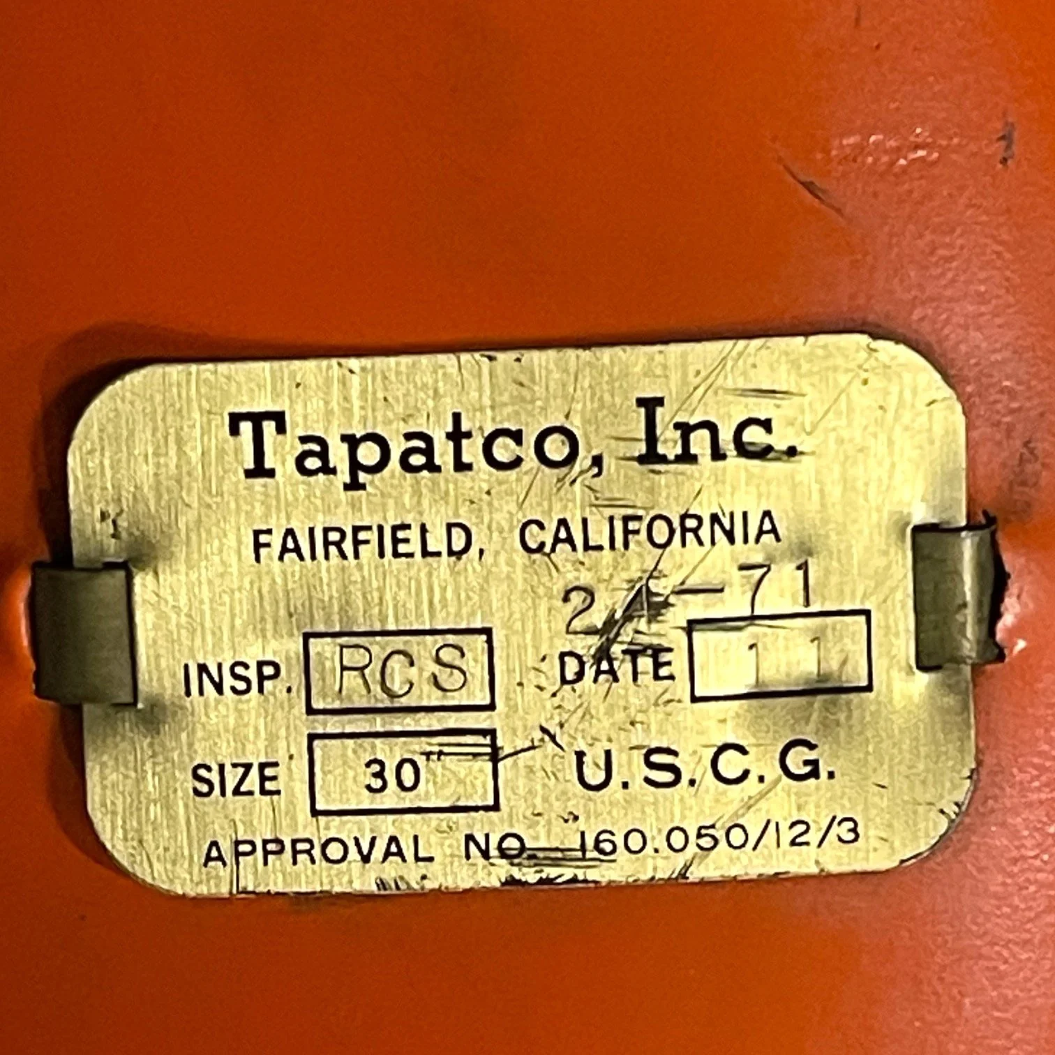 Vintage life preserver buoy, BF Goodrich, manufactured by Tapatco, Inc., 1970s with gold plate, orange with rope.