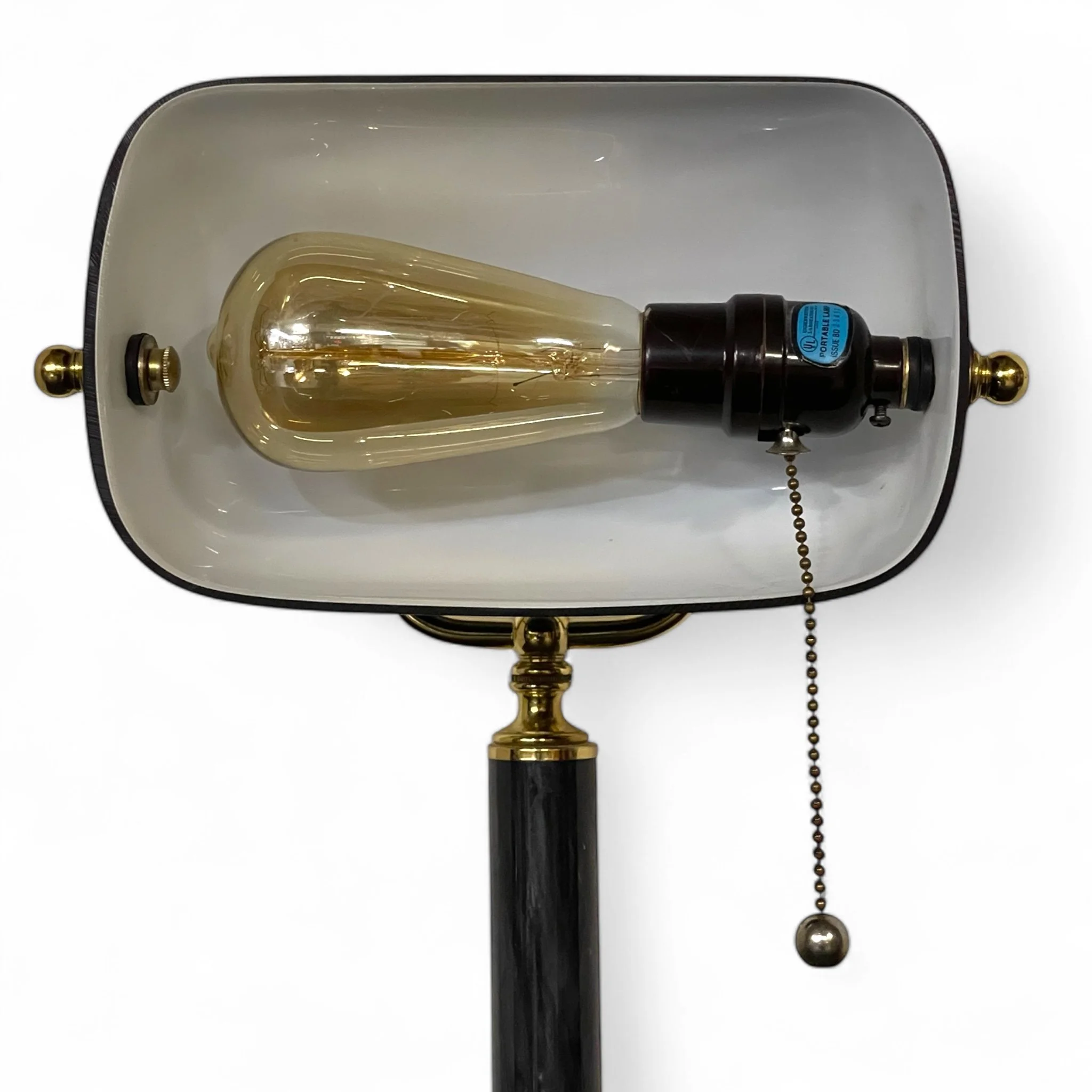 Close up of a vintage bankers desk lamp featuring a sleek black glass shade, fully adjustable, round marble base, perfect for classic office lighting or Art Deco style decor.