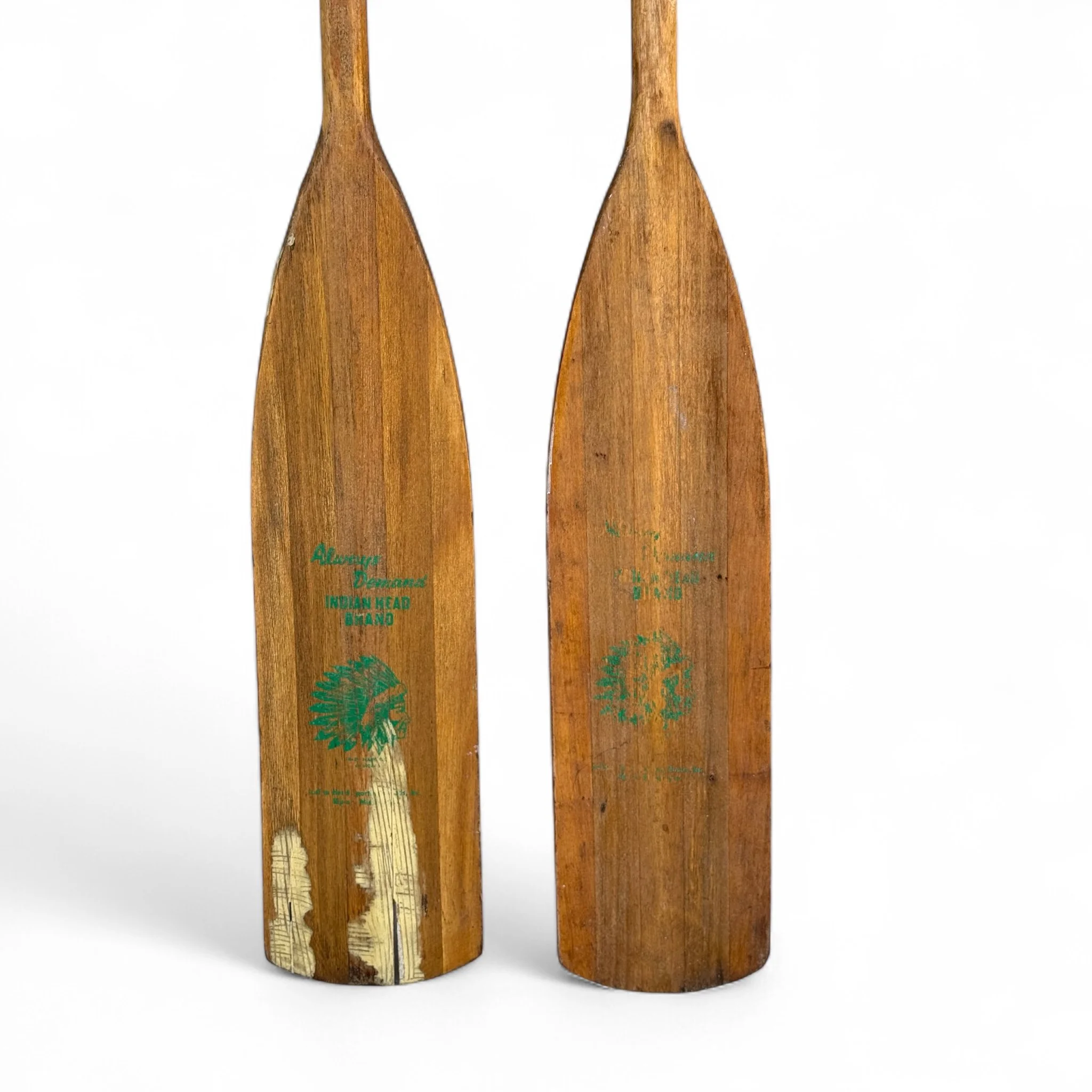 Close up view of the logo on a pair of wooden boat oars by Indian Head Brand