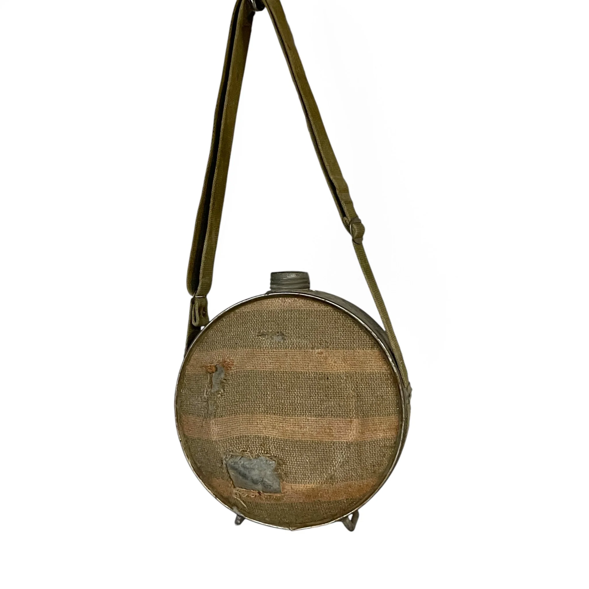 Vintage blanket and galvanized metal canteen with adjustable canvas strap, for rustic decor use.