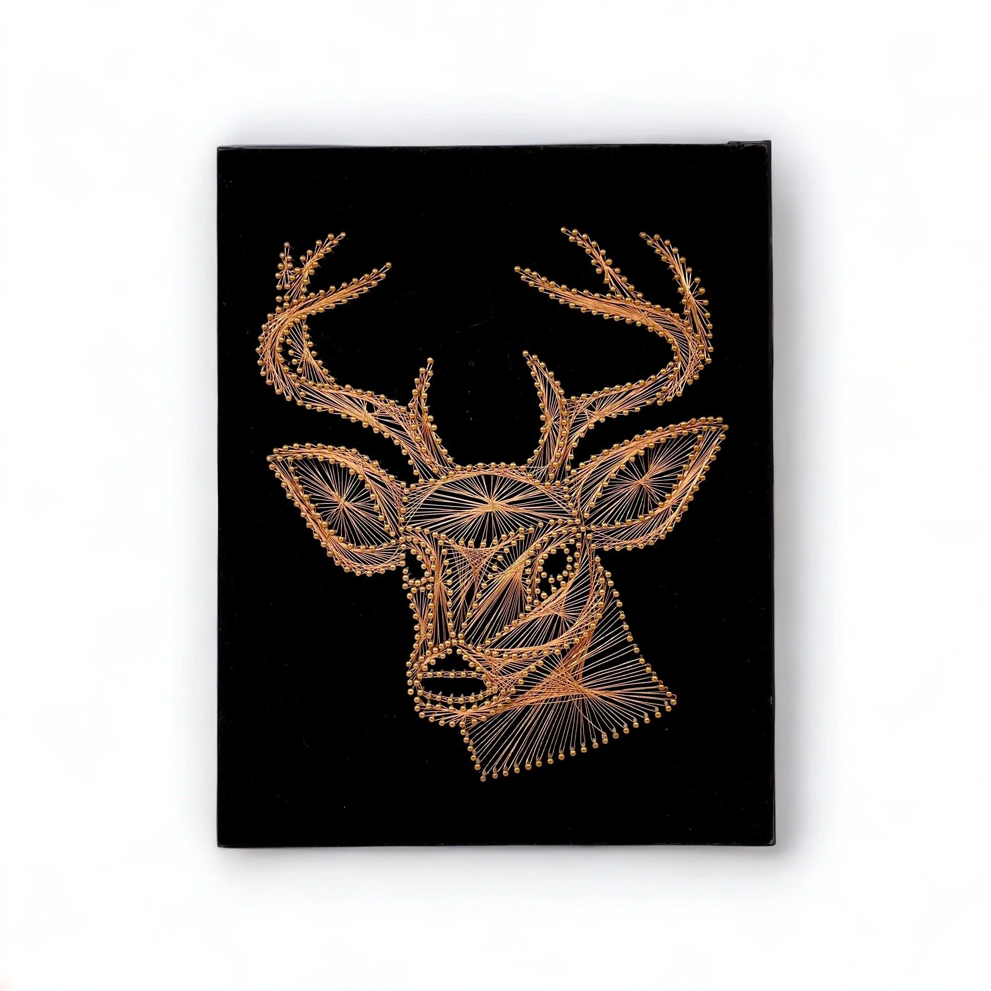 Vintage copper string art of a male deer, buck, on a black velvet board.