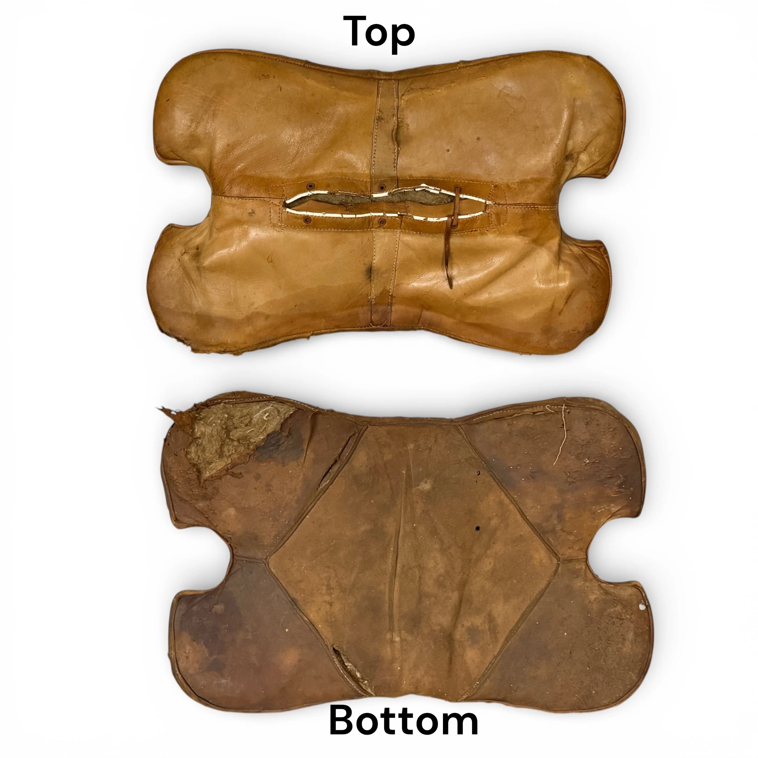A top and bottom view of an old leather cushion with extensive wear and patina for a vintage camel saddle footstool
