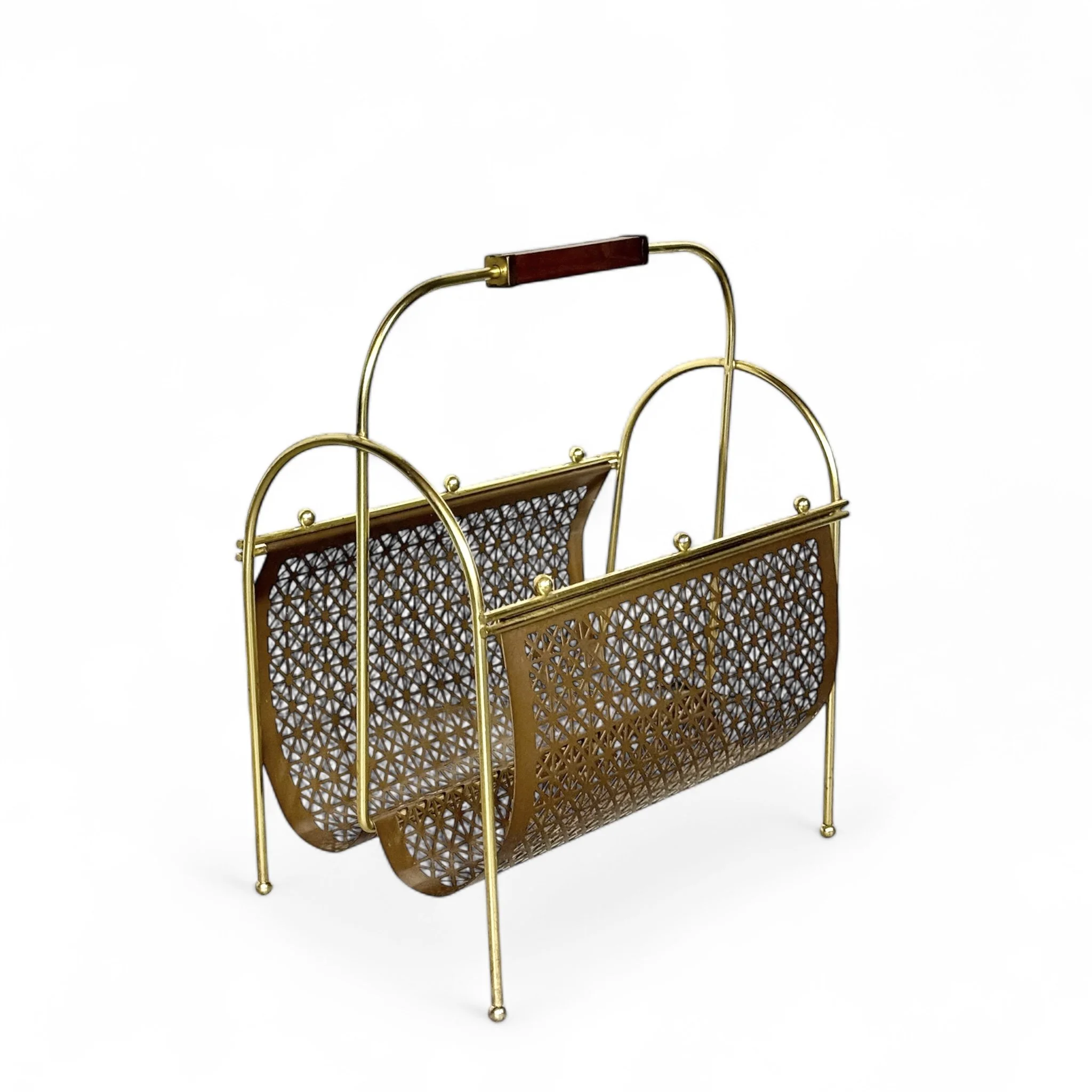 A gold vintage mid century modern magazine rack made of geometric metal pattern and a teak wood handle, ideal for decor or storage.