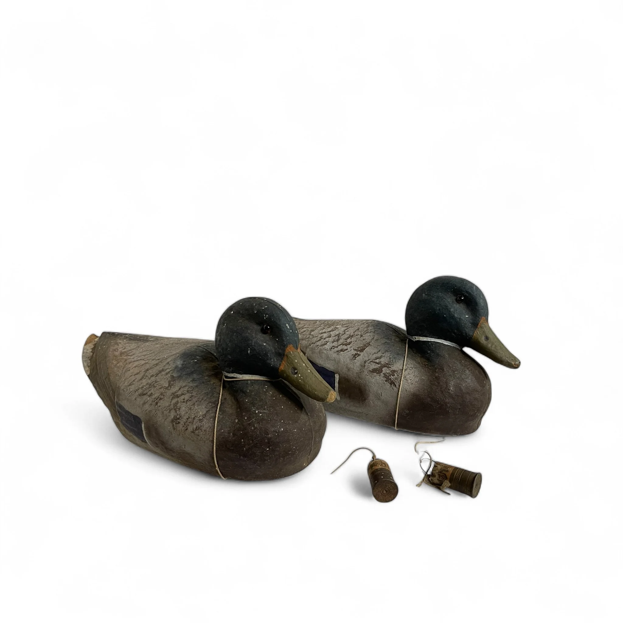 Pair of vintage Featherweight Ariduk duck decoys by General Fibre with a pair of vintage Nitro Express shells used a lead weights
