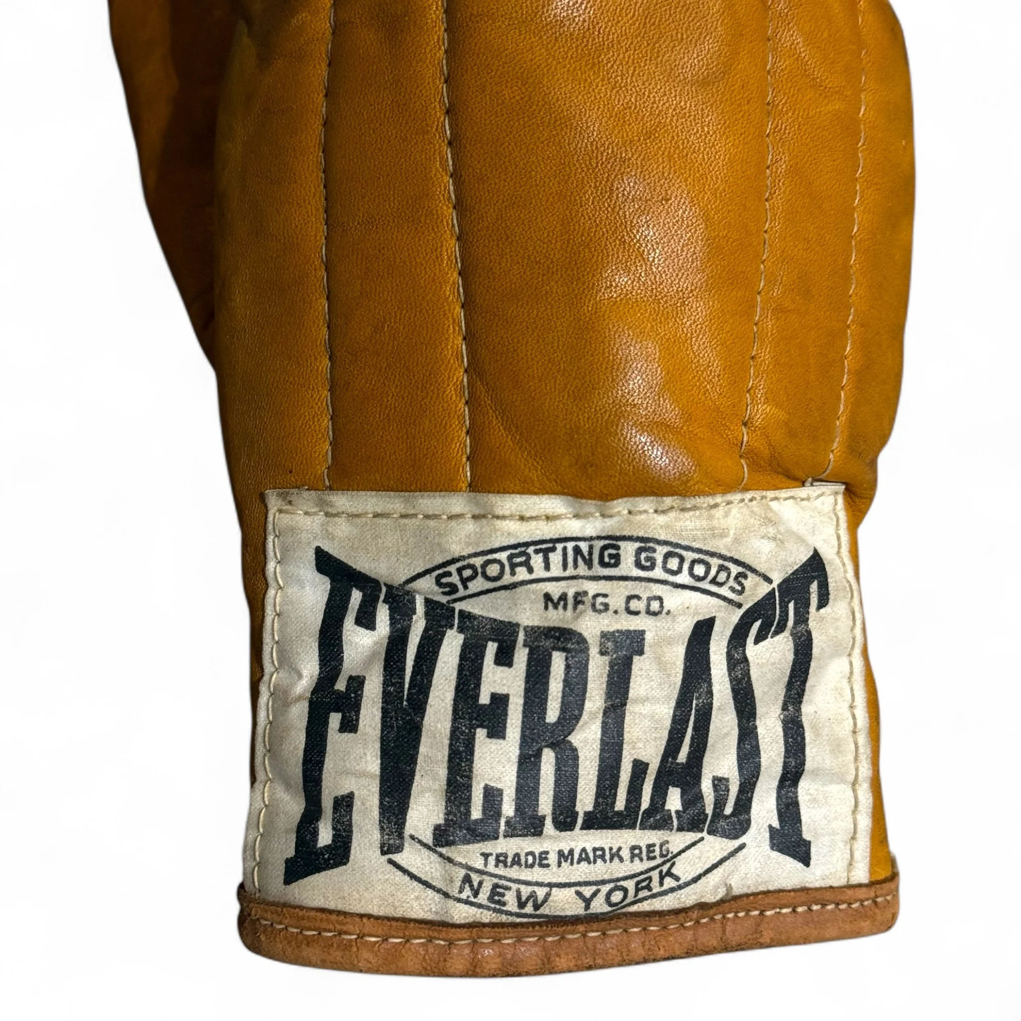Pair of vintage Everlast leather speed boxing gloves in orange brown color with Everlast Sporting Goods logo prominently displayed on the front, retro training gear and collectible boxing decor.