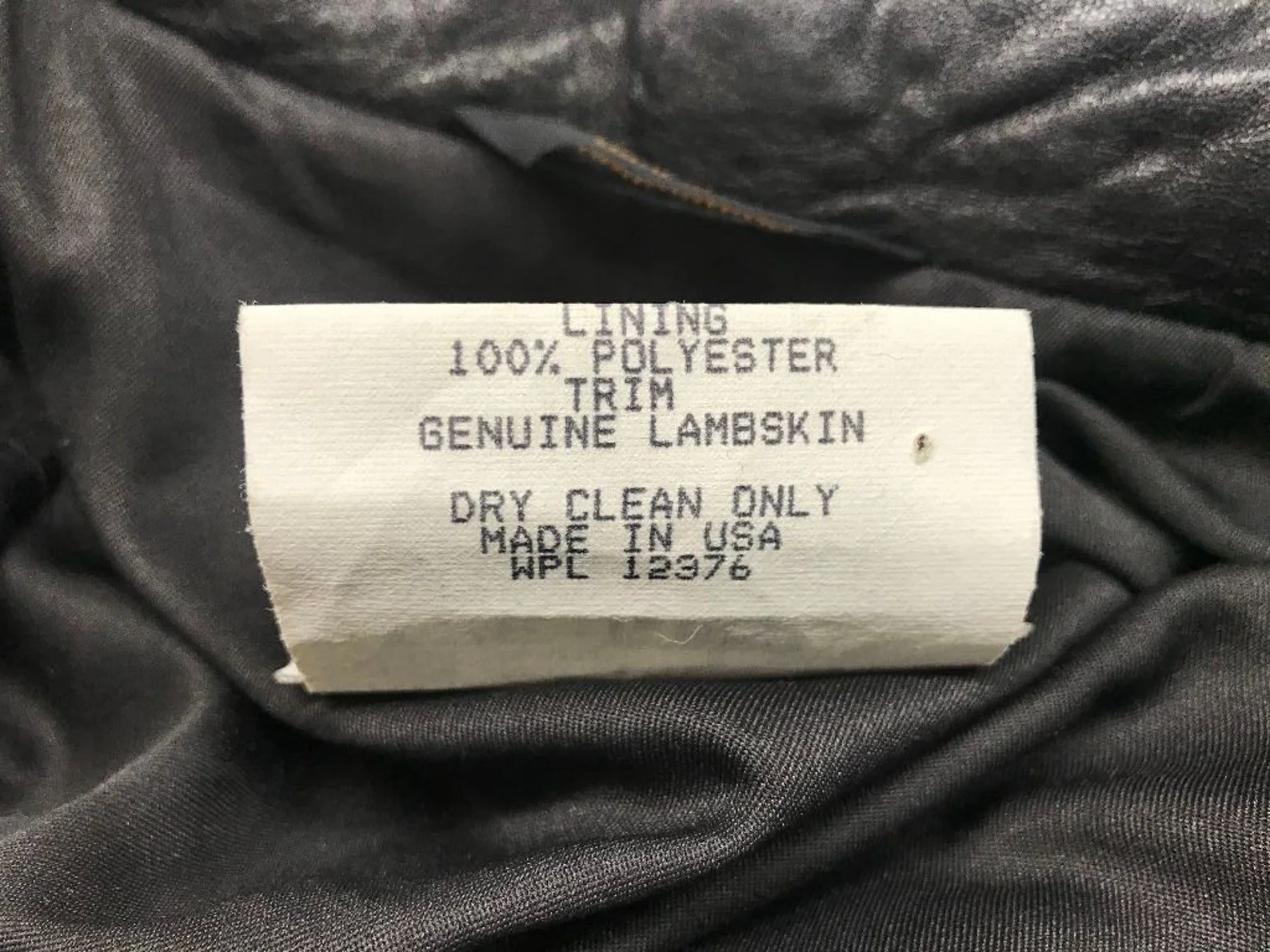 Vintage Pioneer Wear womens size medium black and white houndstooth coat, fully lined, trimmed in black leather, button front closure, two side pockets.