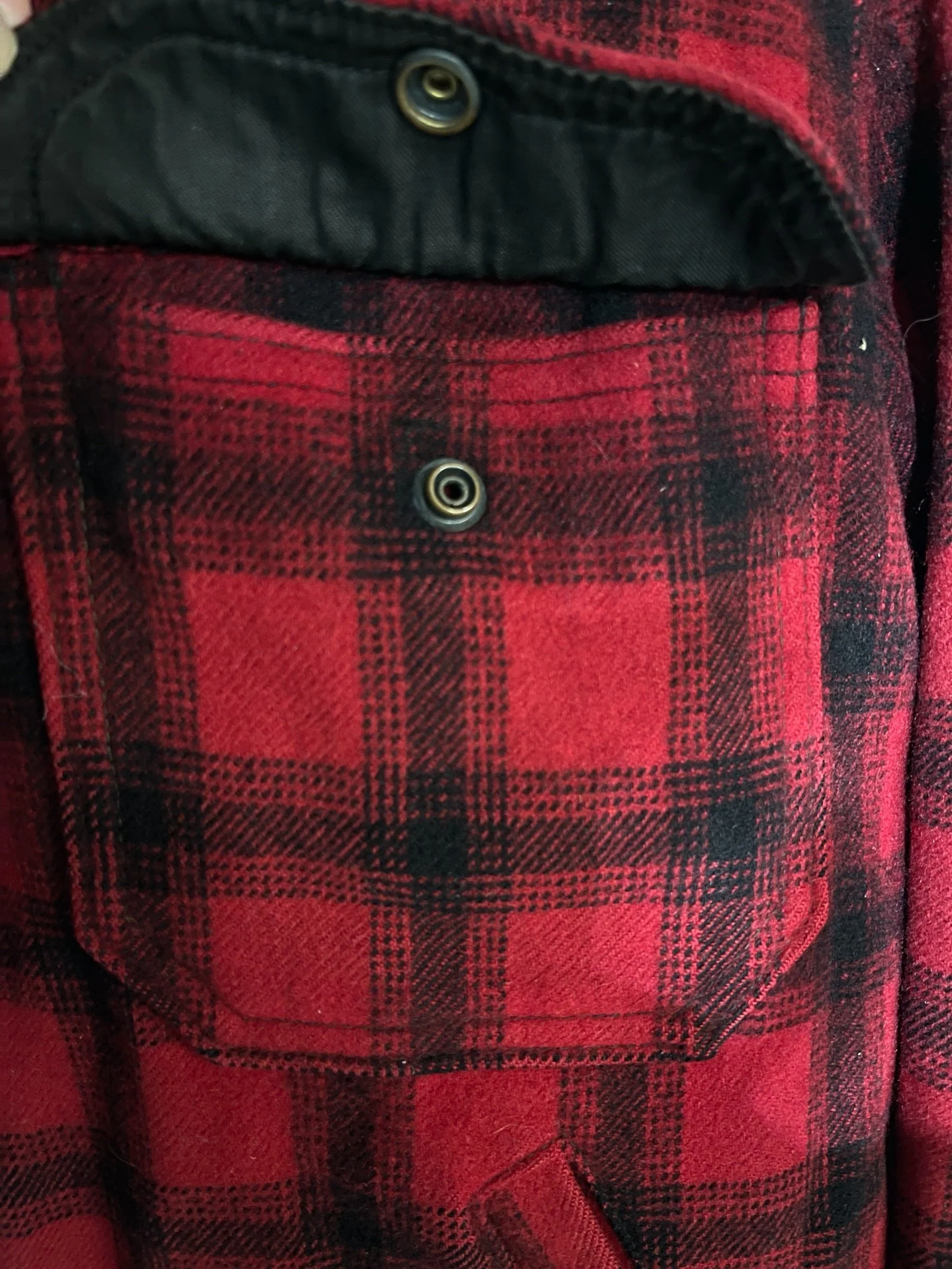 Vintage Woolrich black red plaid wool zip up jacket, fully lined, front pockets, game pocket in back, size 42. Rugged outerwear for the hunting.