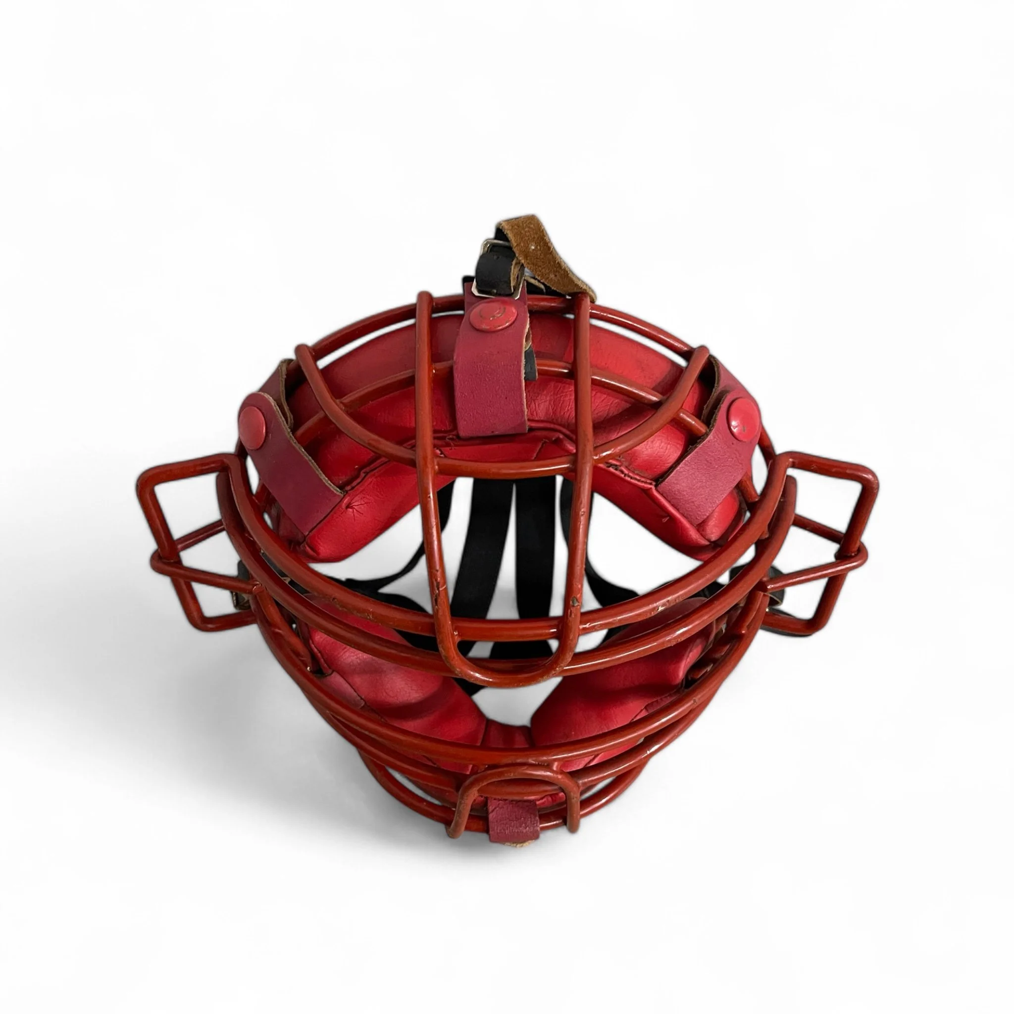 Vintage red baseball catchers face mask by Medalist Gladiator, made of coated metal, leather for decor use in a man cave, game room, or sports themed room.