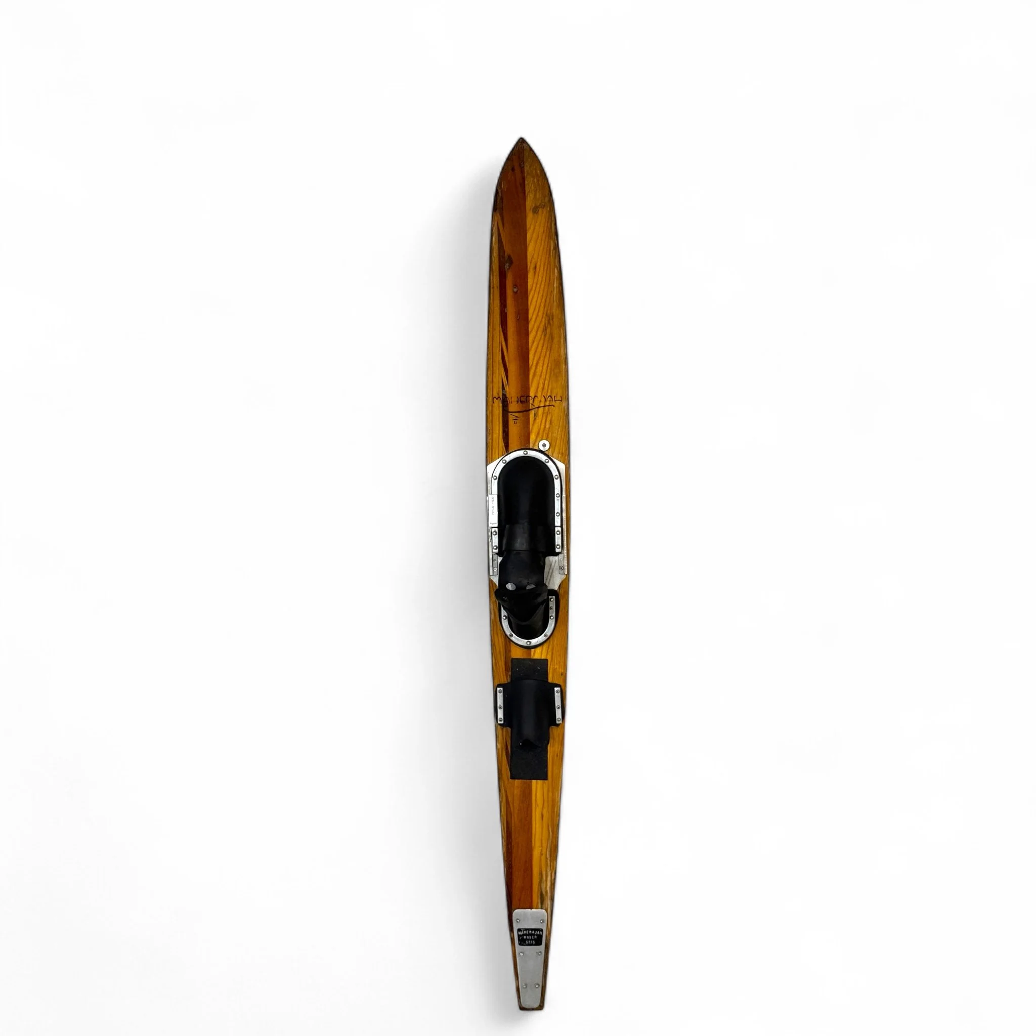 A 68 inch vintage wooden slalom water ski by Maherajah. The ski is made of hardwood and includes original bindings.