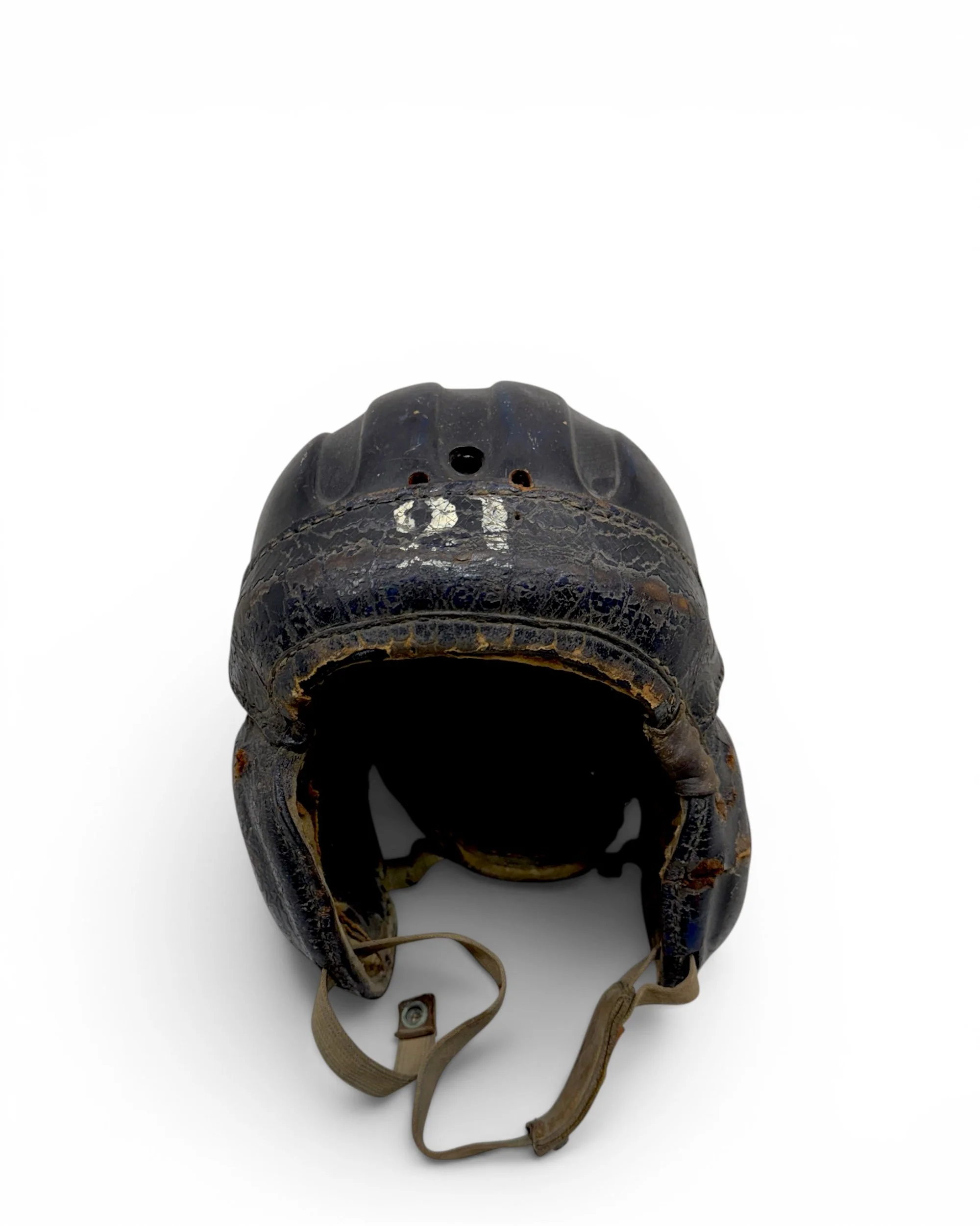 Front view vintage football helmet displaying original leather construction and chin strap.