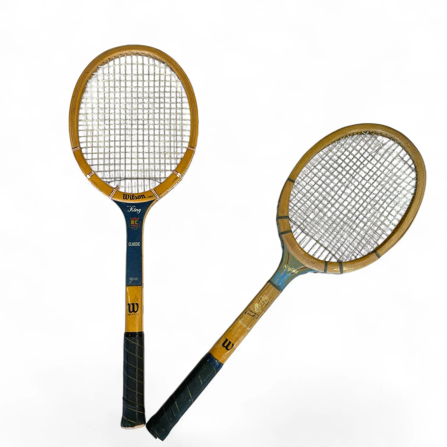 Pair of vintage wooden tennis rackets, including Wilson Stylist Maureen Connolly, and Wilson Billie Jean King Classic. Perfect wall decor for game room or man cave.