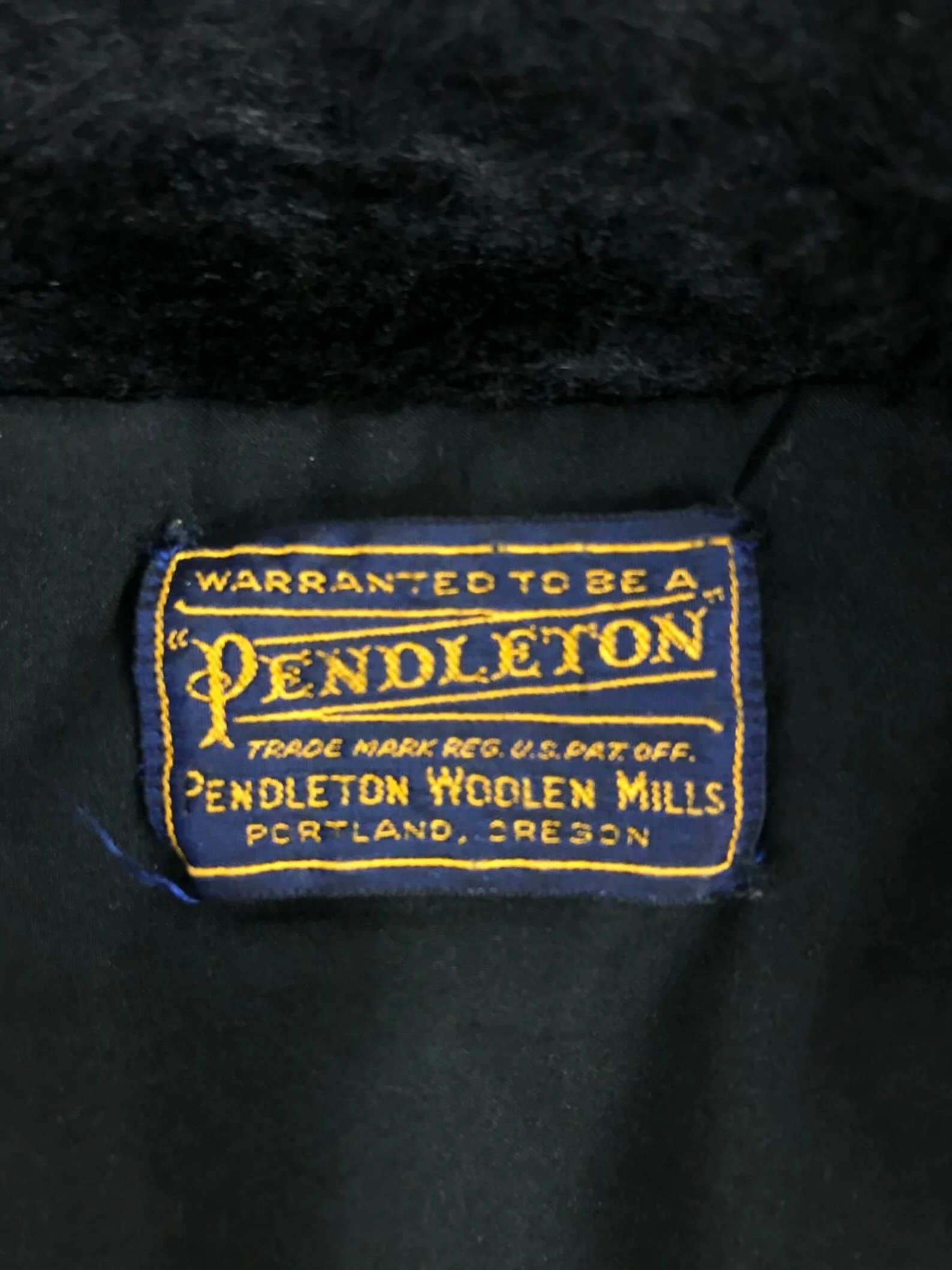 Vintage 1950s womens Pendleton red and black plaid button front wool coat with faux fur collar and side pockets. Fully lined.