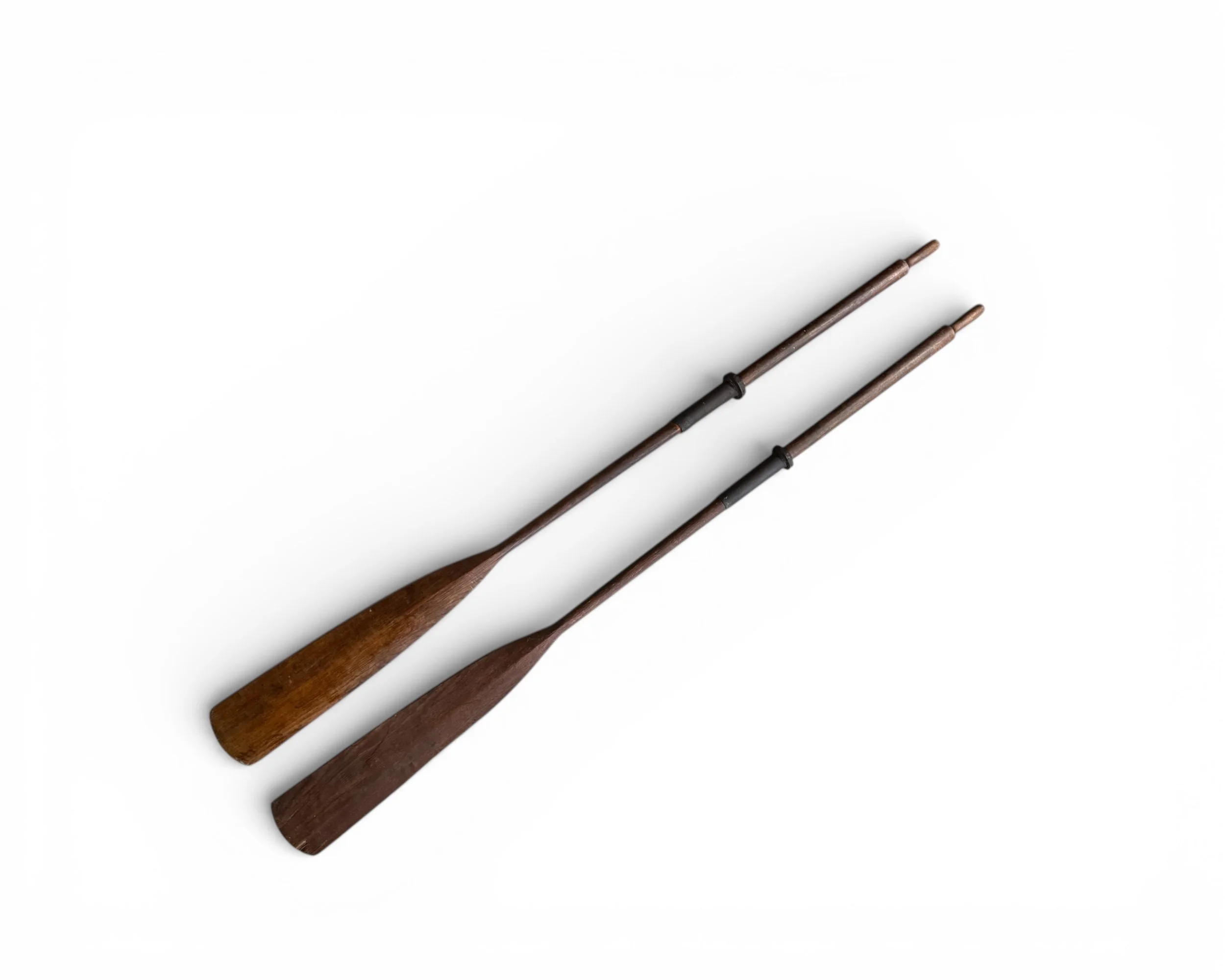 Pair of vintage 84 inch wooden boat oars with leather handle grips for coastal nautical decor