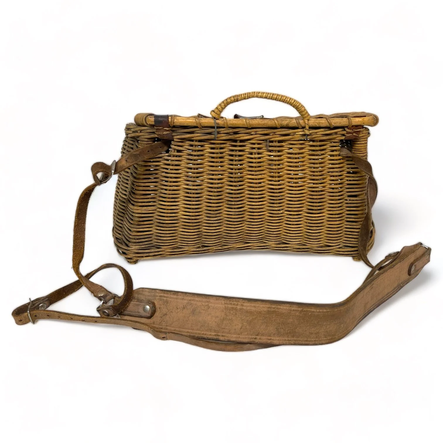 Vintage wicker fishing creel with adjustable leather shoulder strap and leather and metal lid clasp shaped as a fish. Great rustic decor for cabin or lodge.