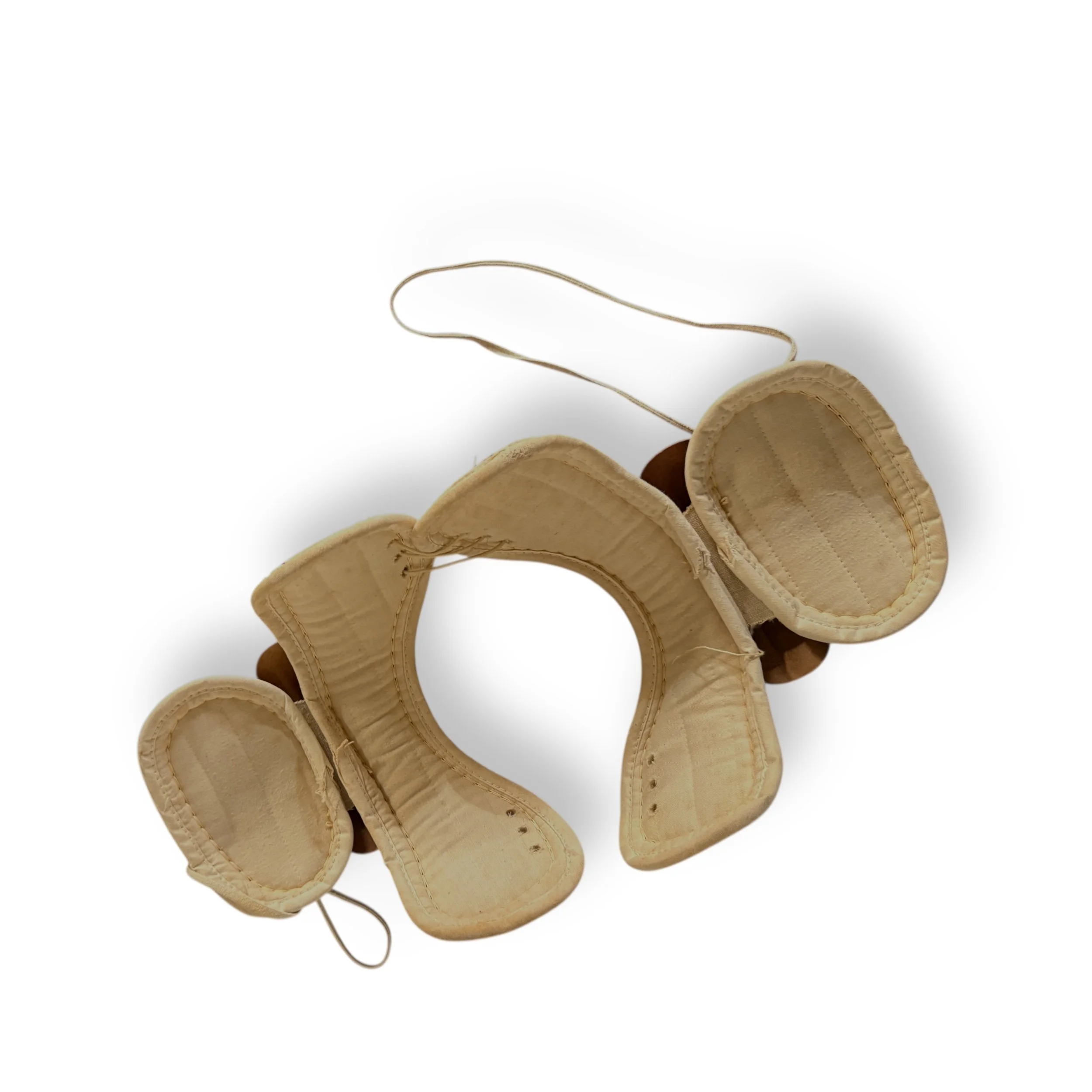 Underside view of vintage shoulder pads by Hutchison, model Hutch S03, made in USA on white background