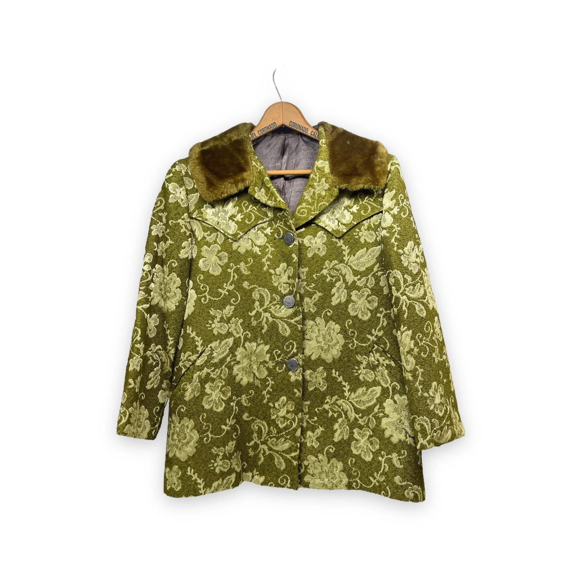 Vintage 1960s women's Westwear jacket in green floral tapestry, classic ranch style with button front closure, fully lined, front pockets, and western yoke detailing.