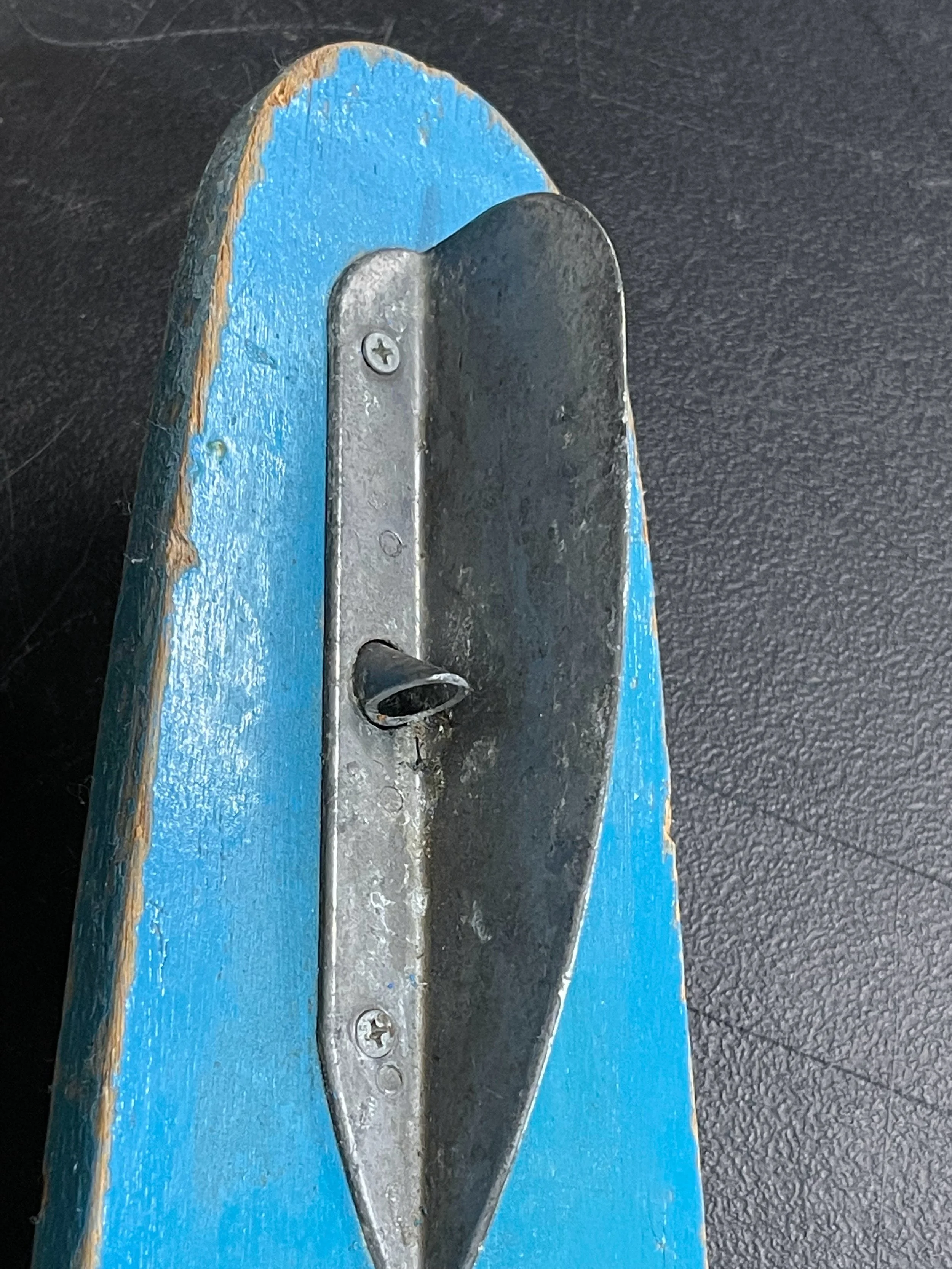 Vintage pair of Twin Rooster wooden water skis in turquoise and yellow with black bindings. Circa 1960s.