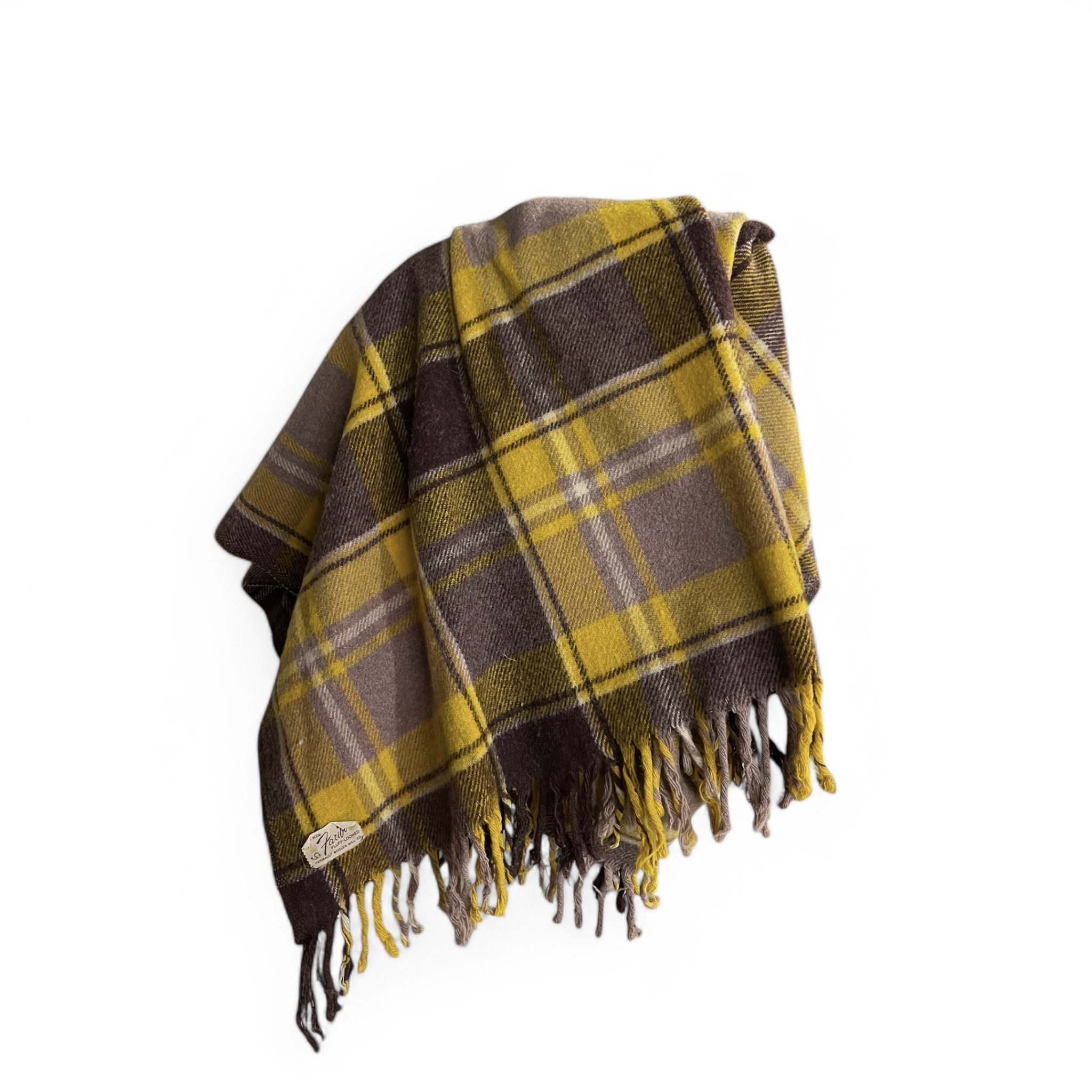 A vintage 100 percent wool brown and yellow plaid throw blanket by Faribo measuring 49x53 inches. Perfect for a cozy winter sofa throw or lap blanket.