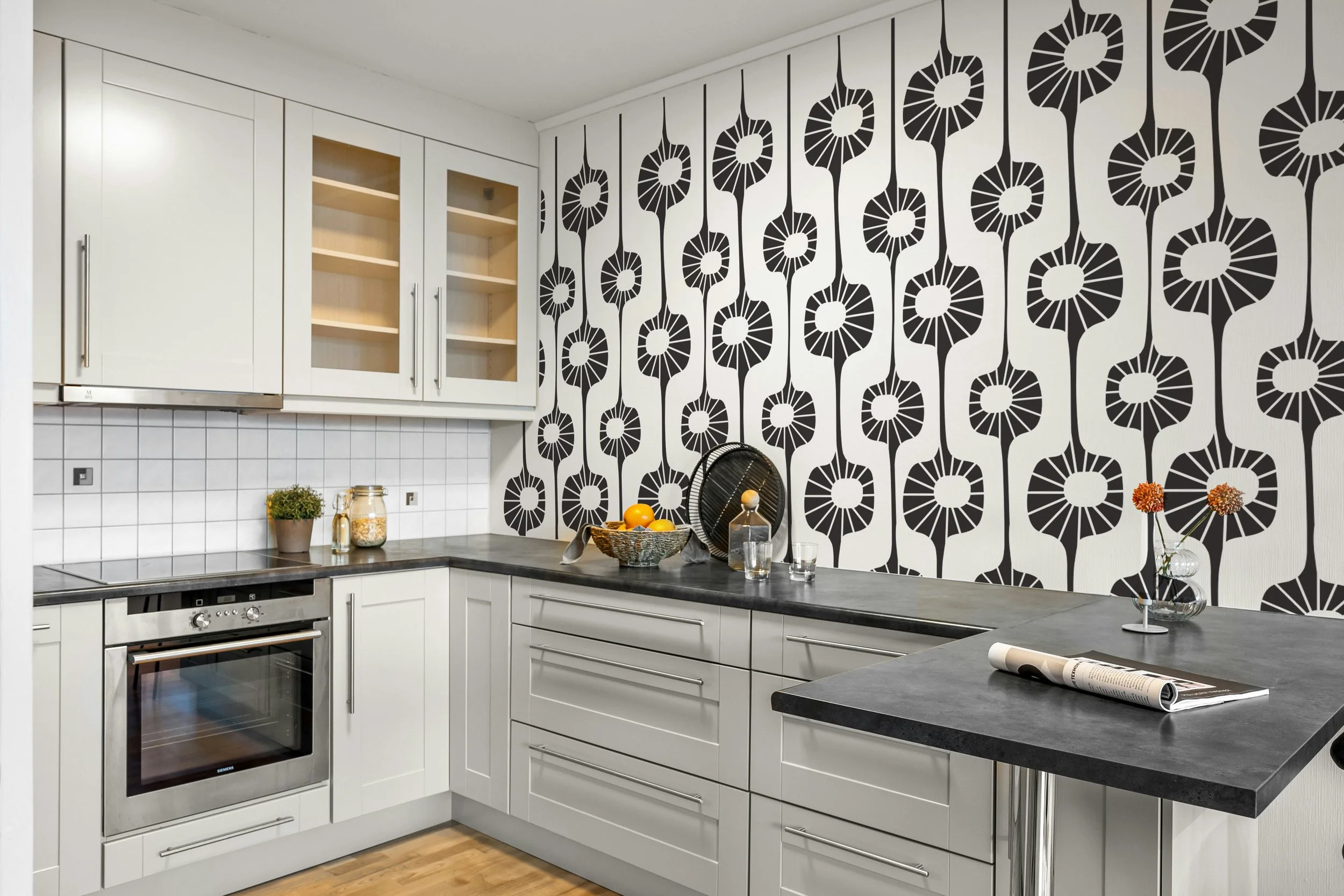 Mid century inspired black wall decal on kitchen accent wall.
