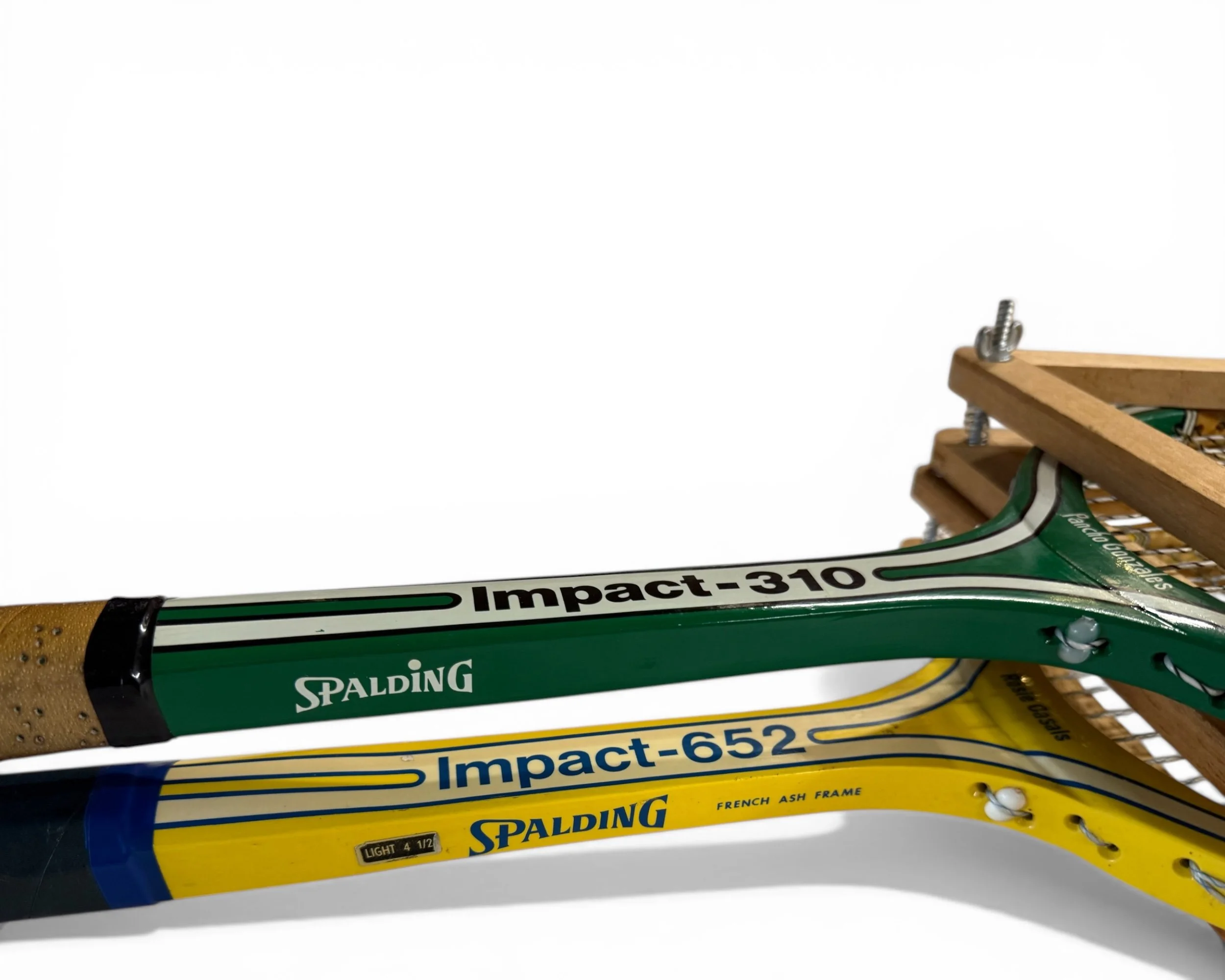 Side view 1970s Spalding green and yellow Impact wooden tennis rackets with wooden presses - country club wall decor