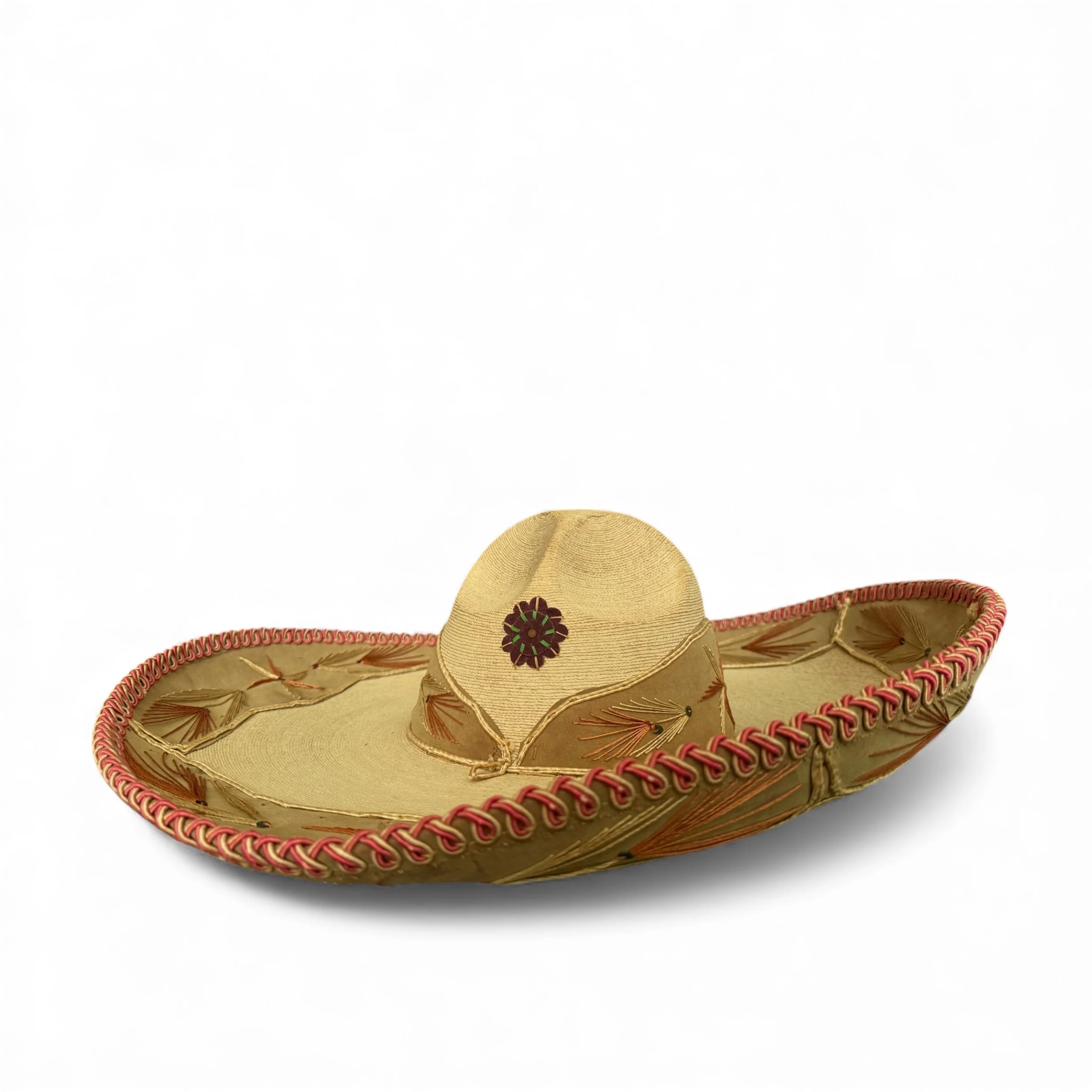 Full front view of vintage charro Mexican hat with detailed embroidered stitching in shades of light brown and pink