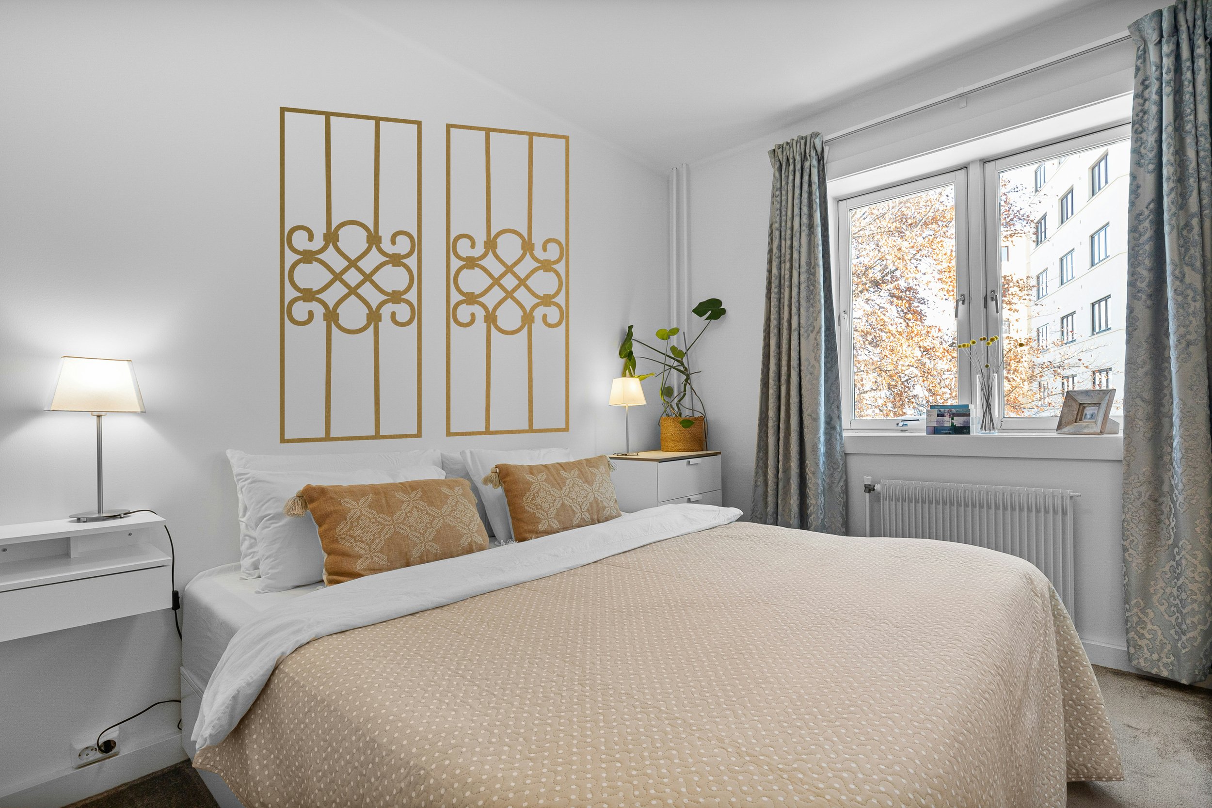 Architectural peel and stick wall decals adding vertical symmetry to a modern Scandinavian bedroom.