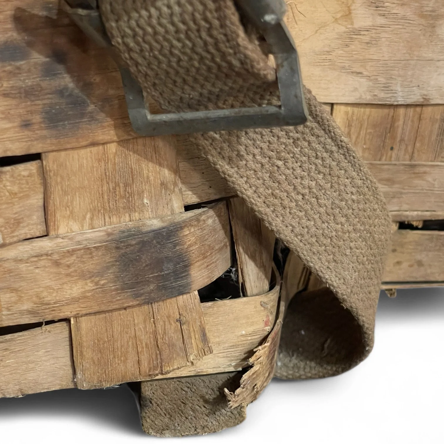 Close up view of a large vintage Adirondack Pack Basket - 2 Compartments, 1 with lid, canvas adjustable shoulder straps.