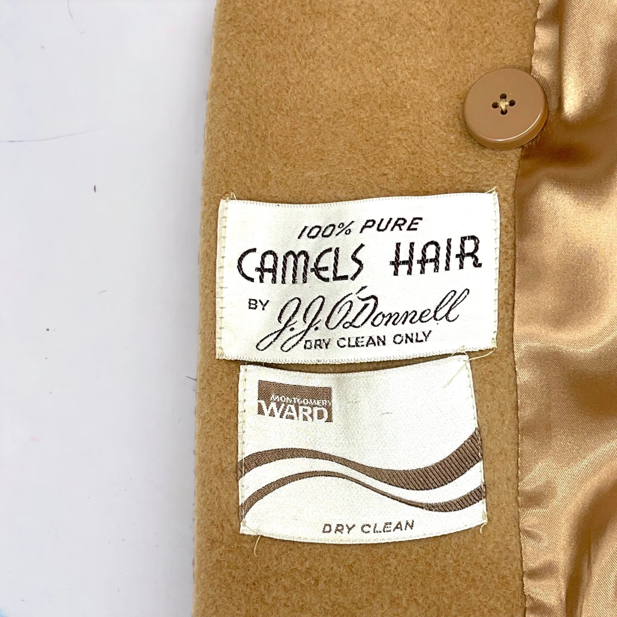 Vintage womens fully lined double breasted button front camel hair coat by JJ ODonnell for Montgomery Ward.