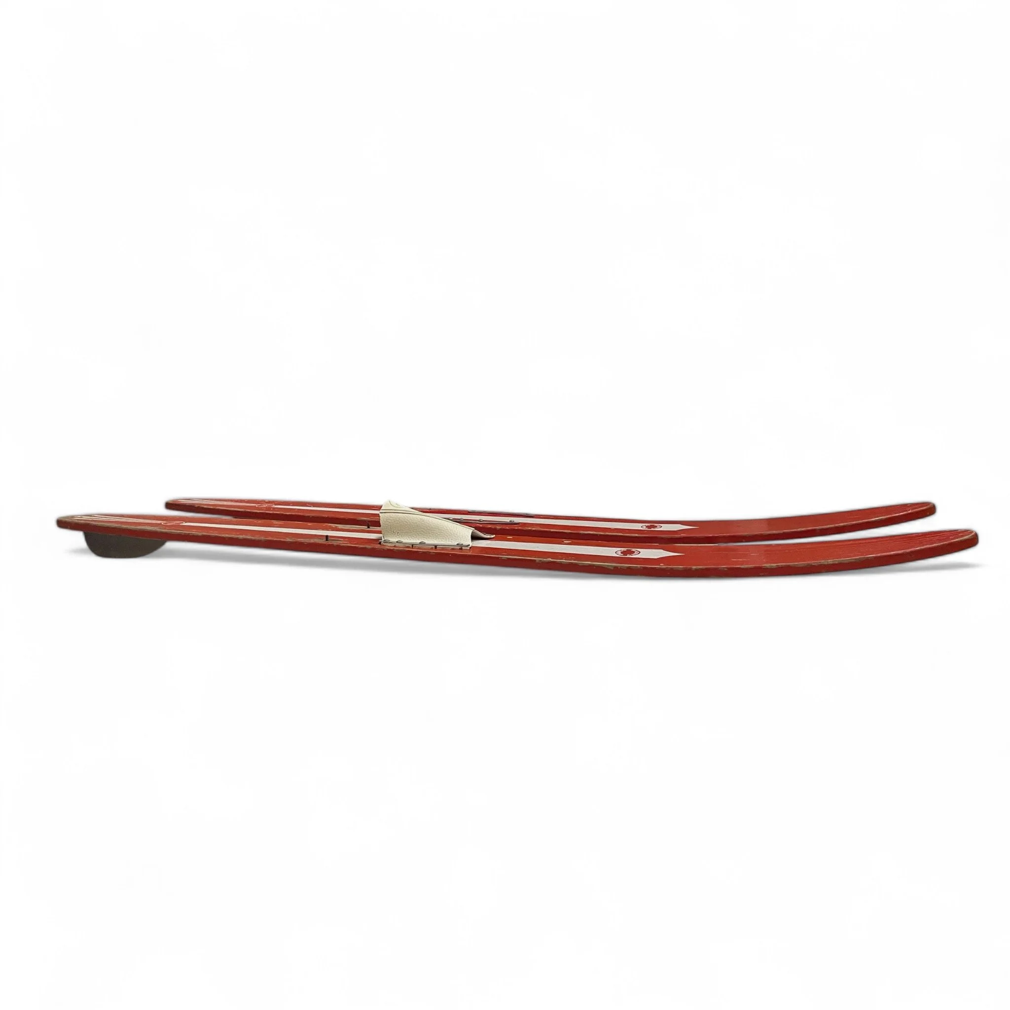Vintage pair of red white Sears Shorty Combo wooden water skis, well weathered and perfect for beach house decor.