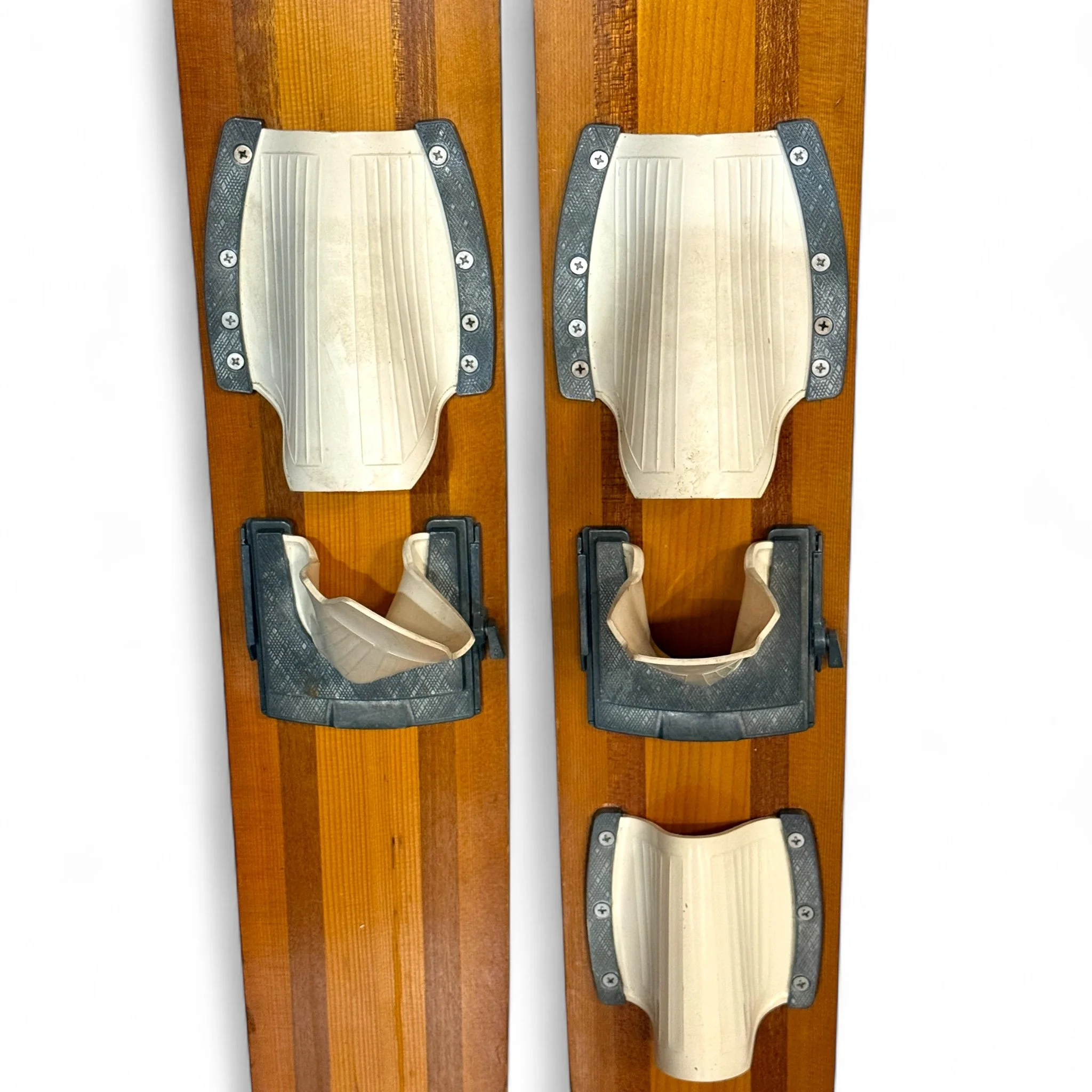 Vintage 1960s wooden water skis with a rare mermaid riding dolphin logo, ideal for nautical wall decor, lake cabin display, or beach house decoration.
