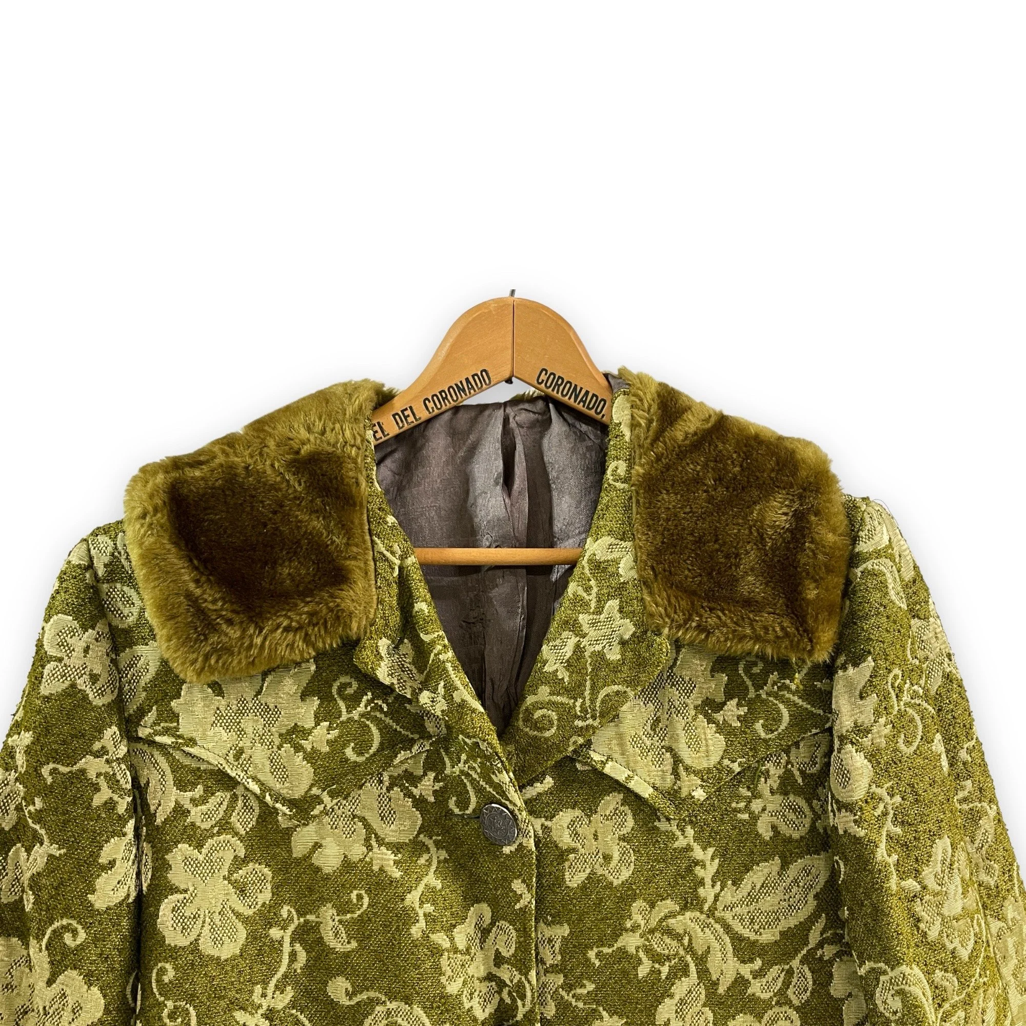 Vintage 1960s women's Westwear jacket in green floral tapestry, classic ranch style with button front closure, fully lined, front pockets, and western yoke detailing.