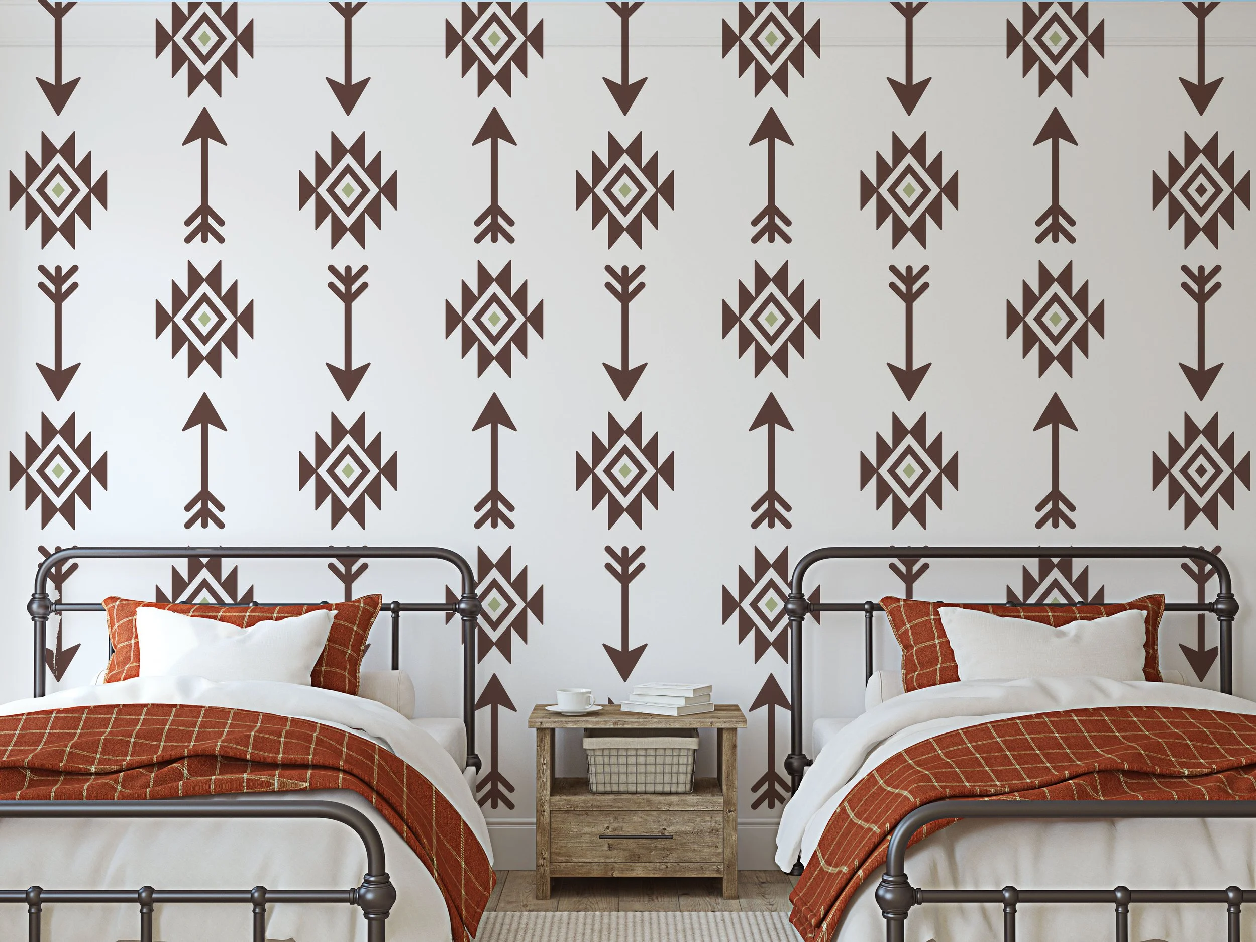 Two color, Aztec pattern and arrow wall decals by Wall Star Graphics. Installed on a white wall behind two twin iron beds in a rustic modern bedroom.
