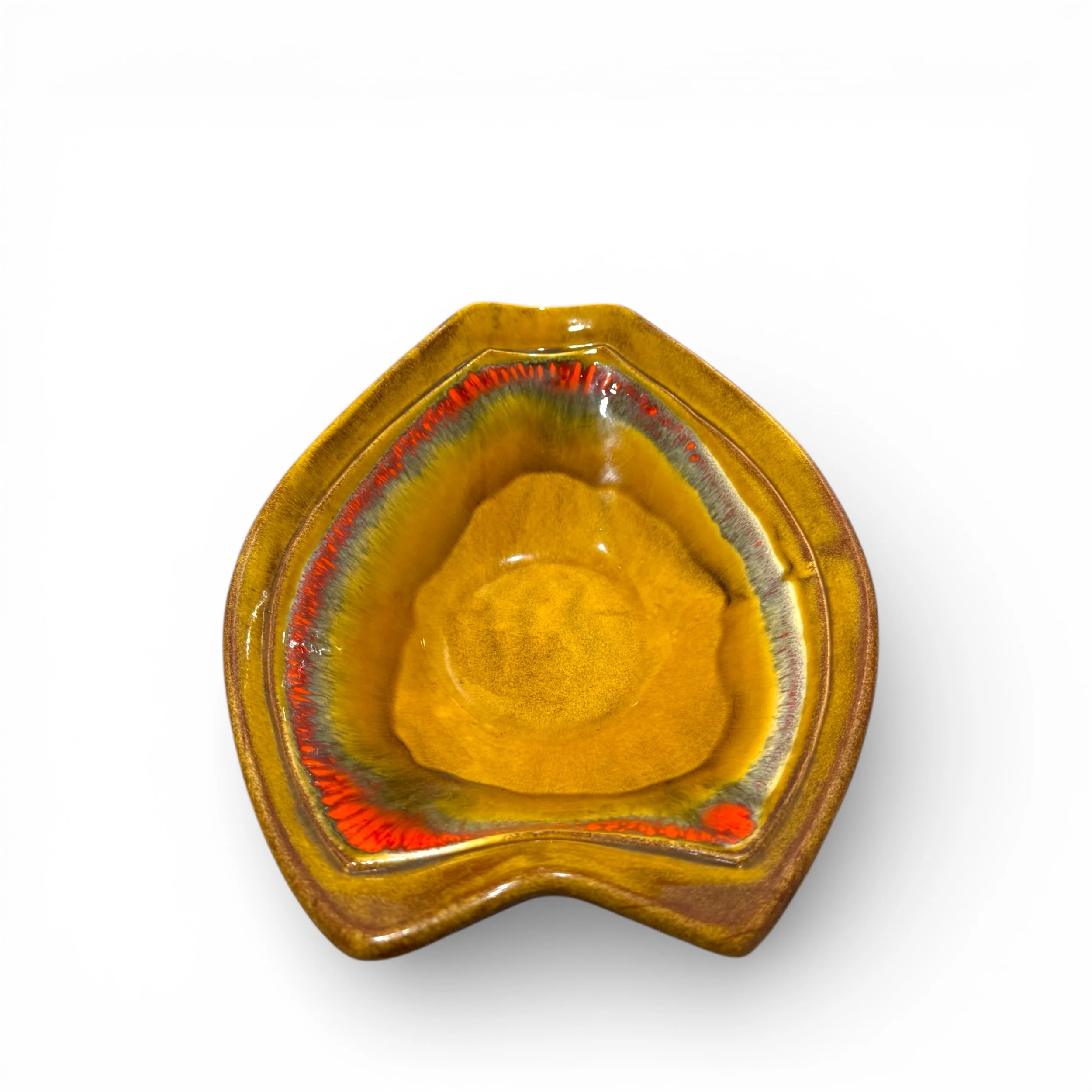 Top view of a colorful glazed ceramic atomic shaped dish perfect for mid century modern interiors