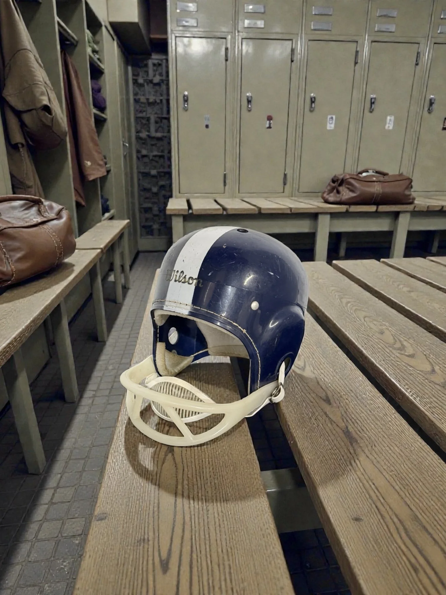 Vintage sports memorabilia decor featuring retro football helmet display piece in an old school locker room.