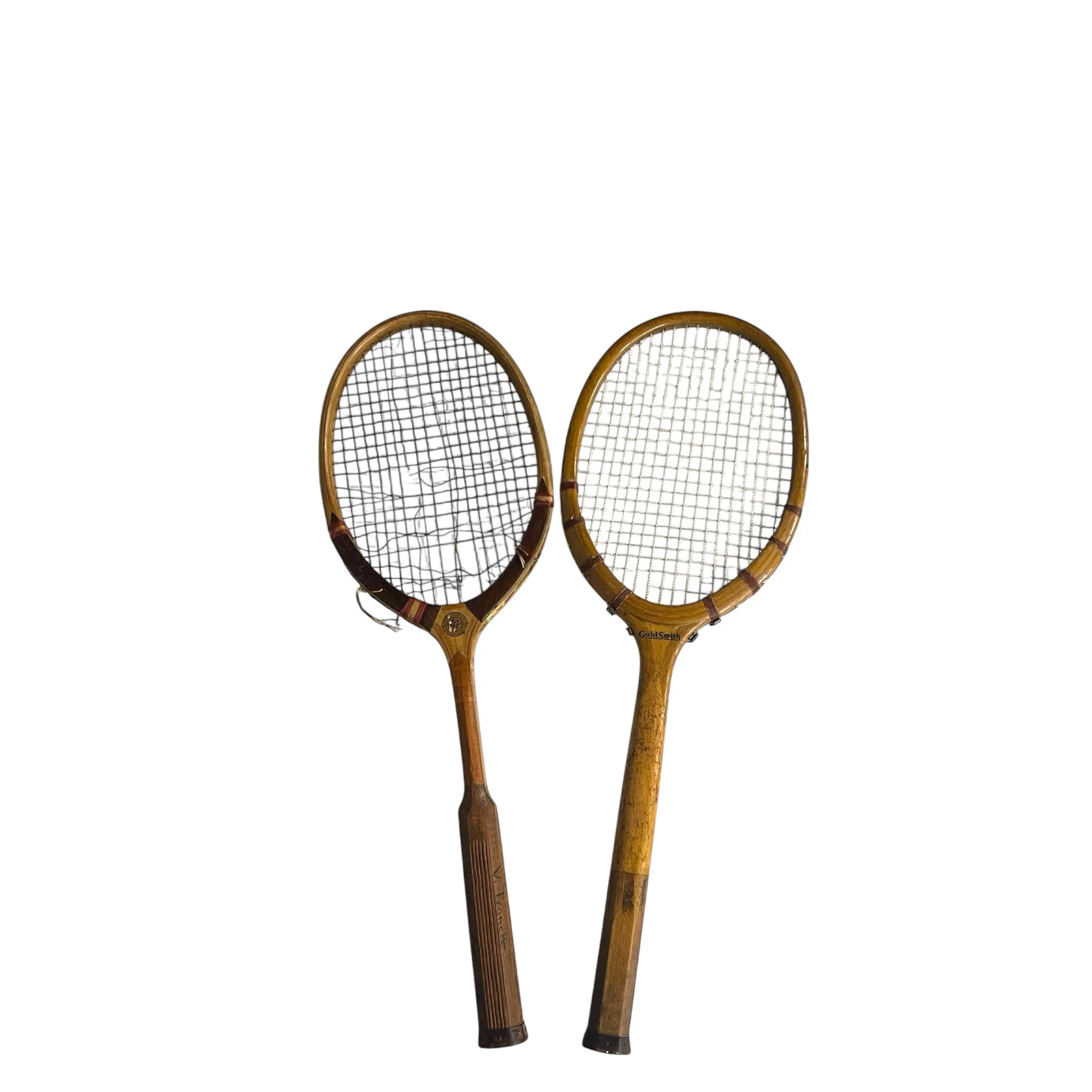 Pair of vintage wooden tennis rackets from the 1920s-30s, perfect for antique sports decor and collectibles.