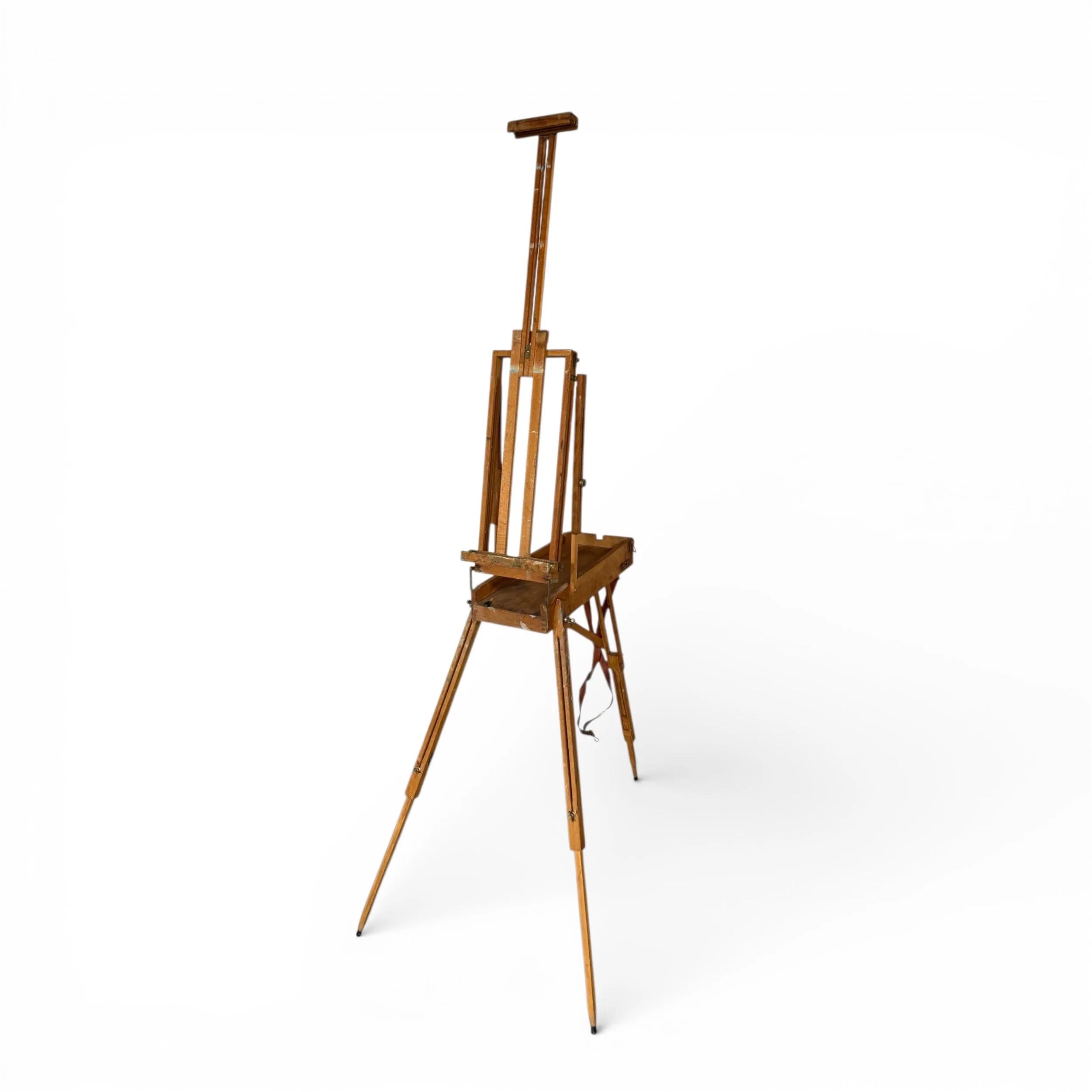 side view of a vintage wooden floor French easel, fully extended 72 inches tall.