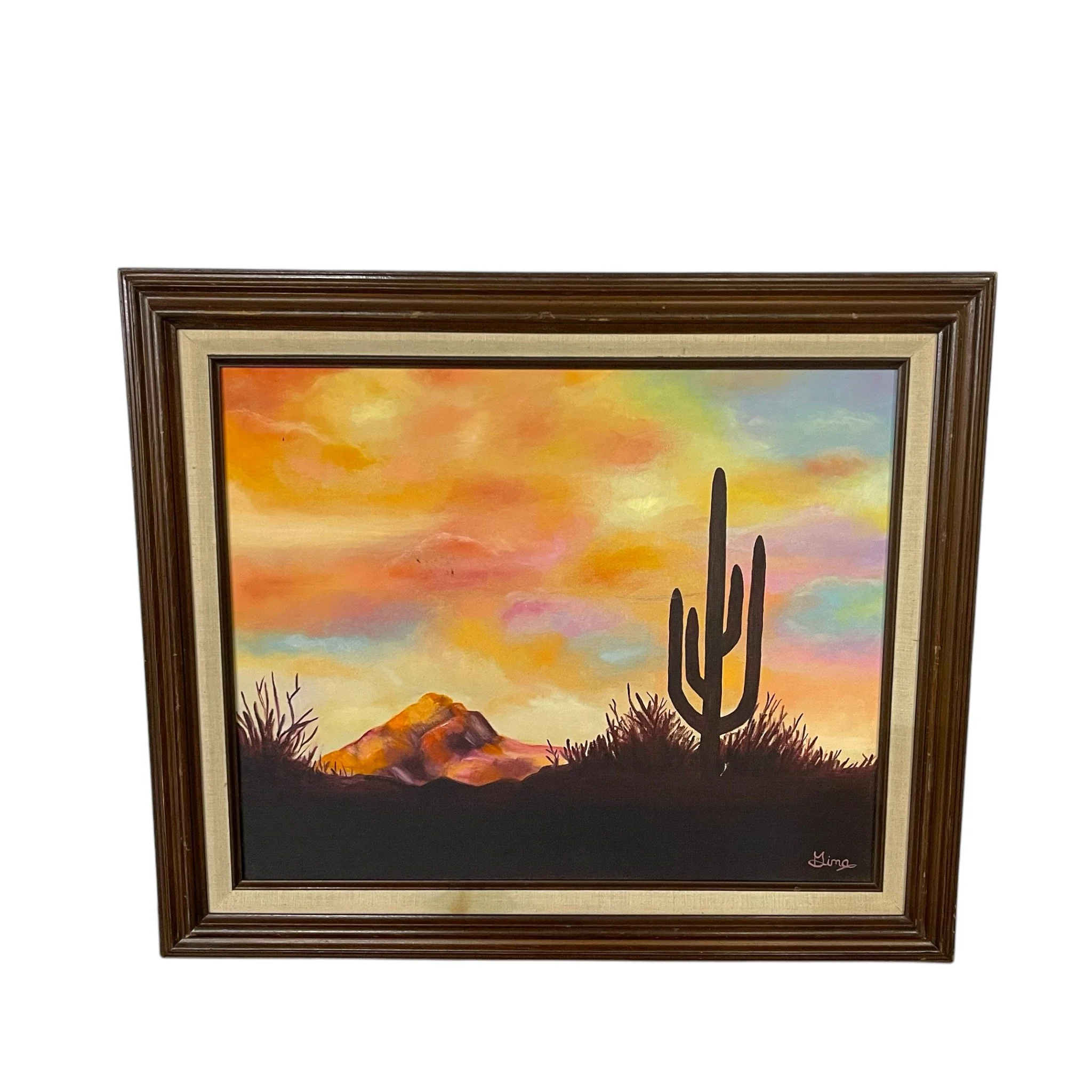 Vintage original oil painting of a desert at sunset featuring cactus, mountain under a colorful sky, framed, signed by artist. Ideal southwestern or boho interior decor.
